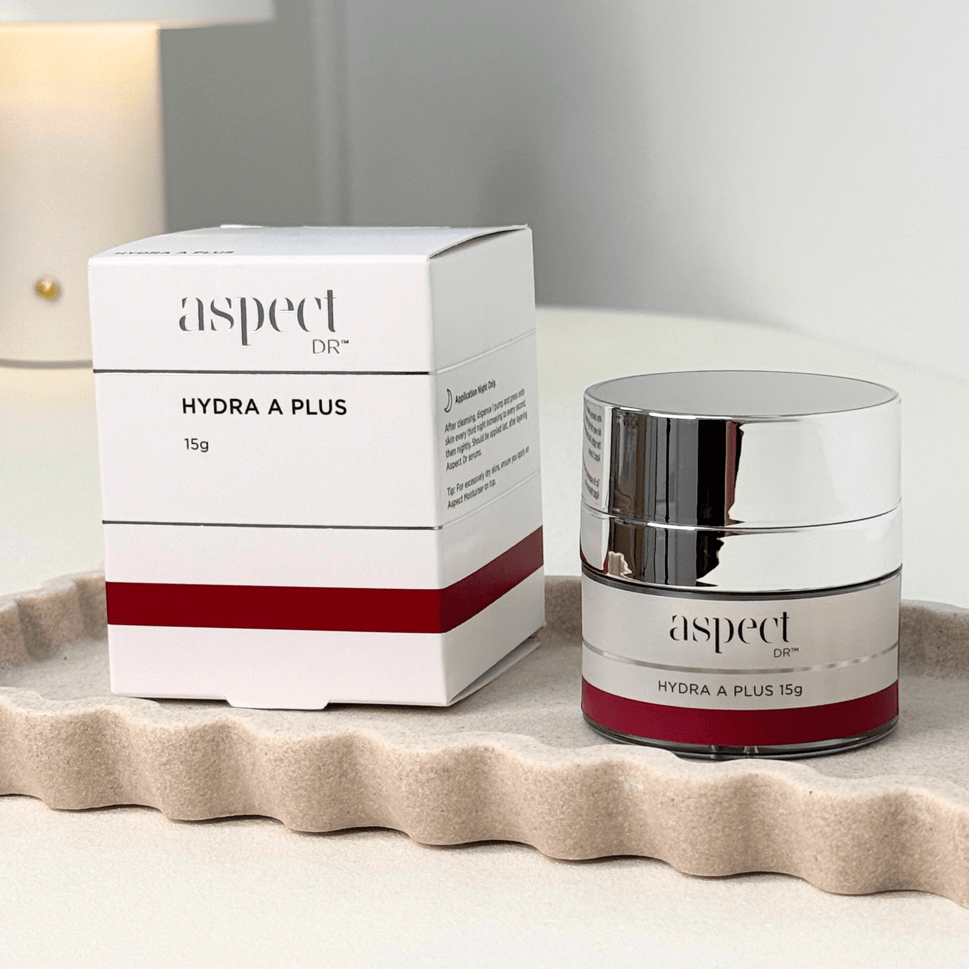 Aspect Dr Hydra A Plus 15g jar and packaging on a beige background