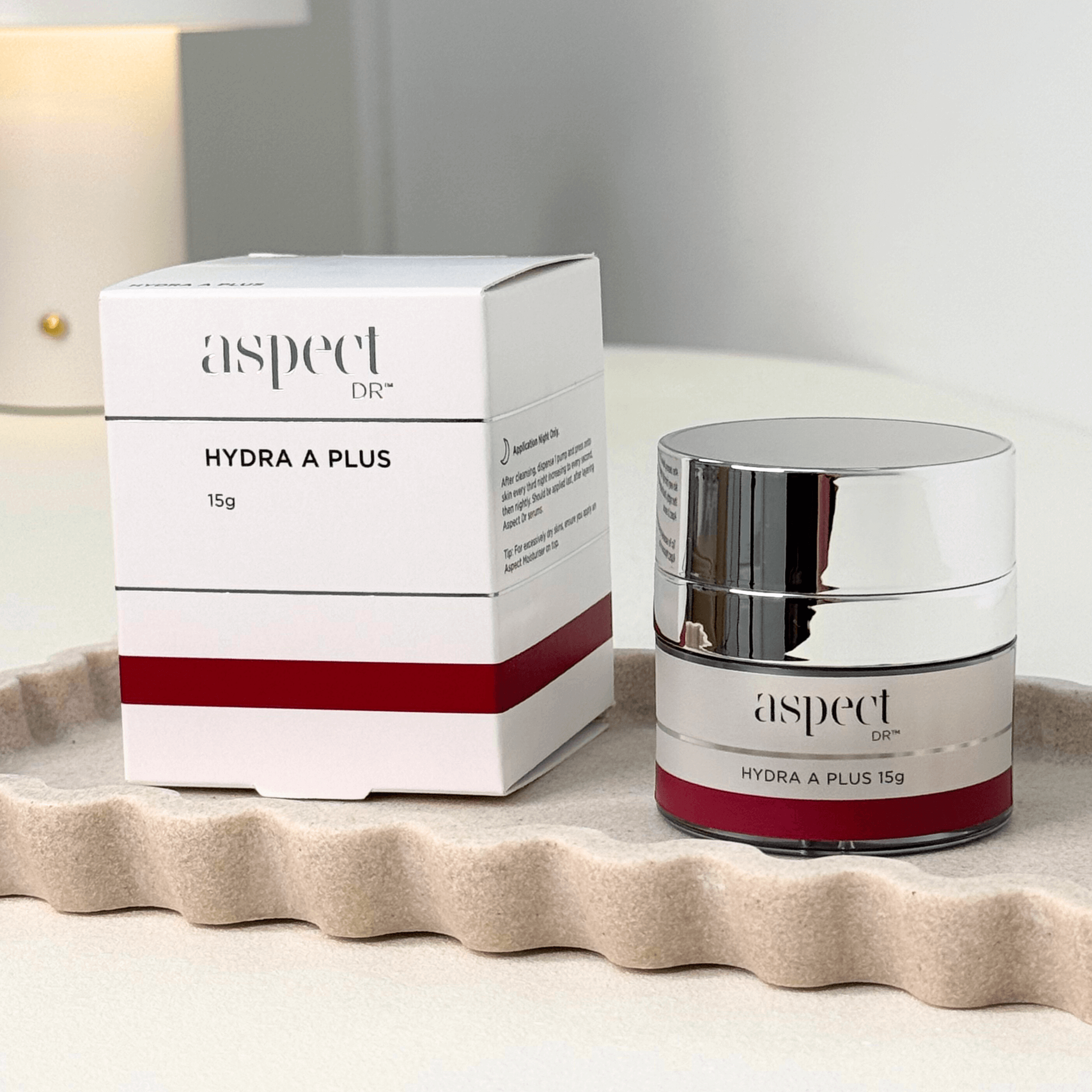 Aspect Dr Hydra A Plus 15g jar and packaging on a beige background