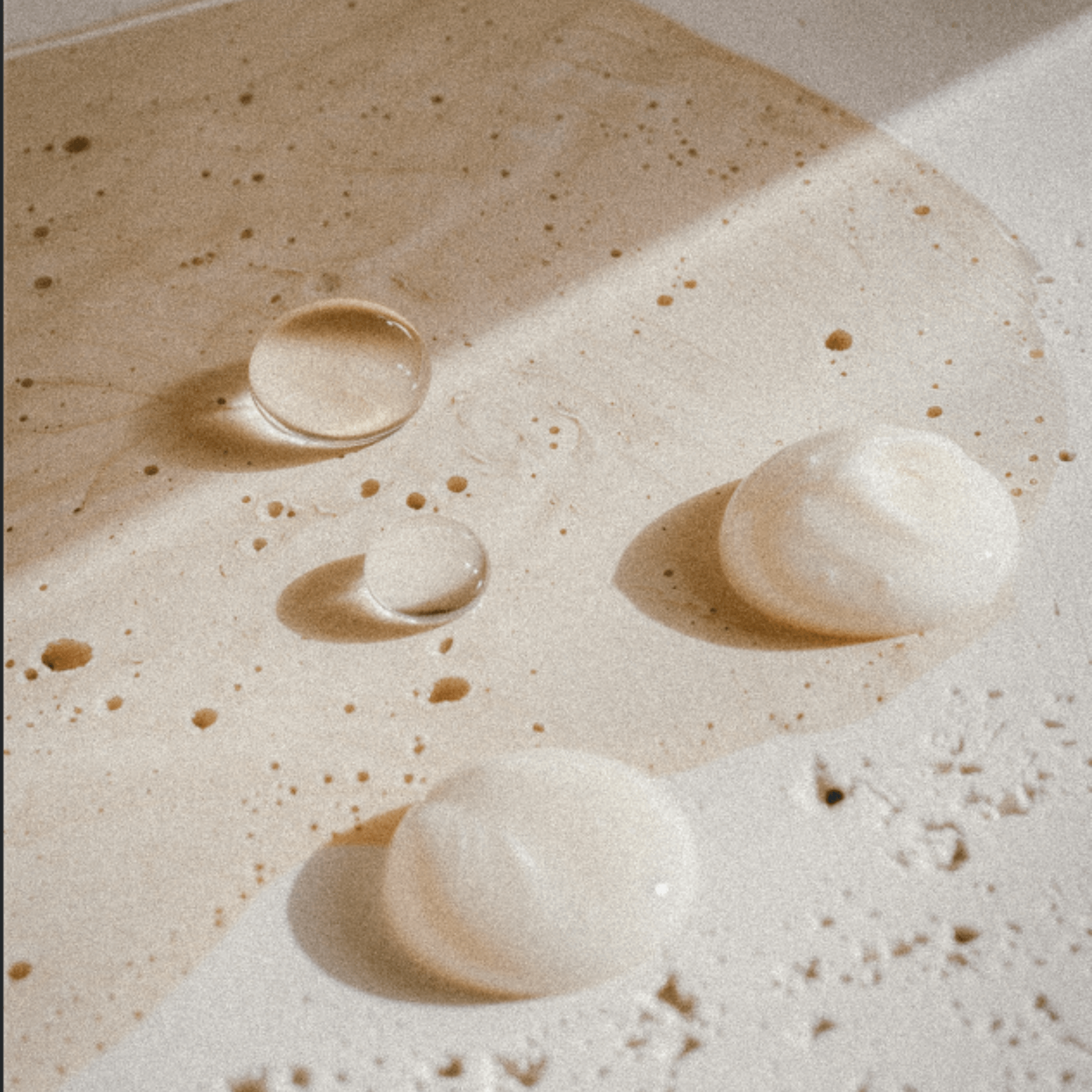Australian Cosmeceutical skin care multiple swatches on neutral stone background