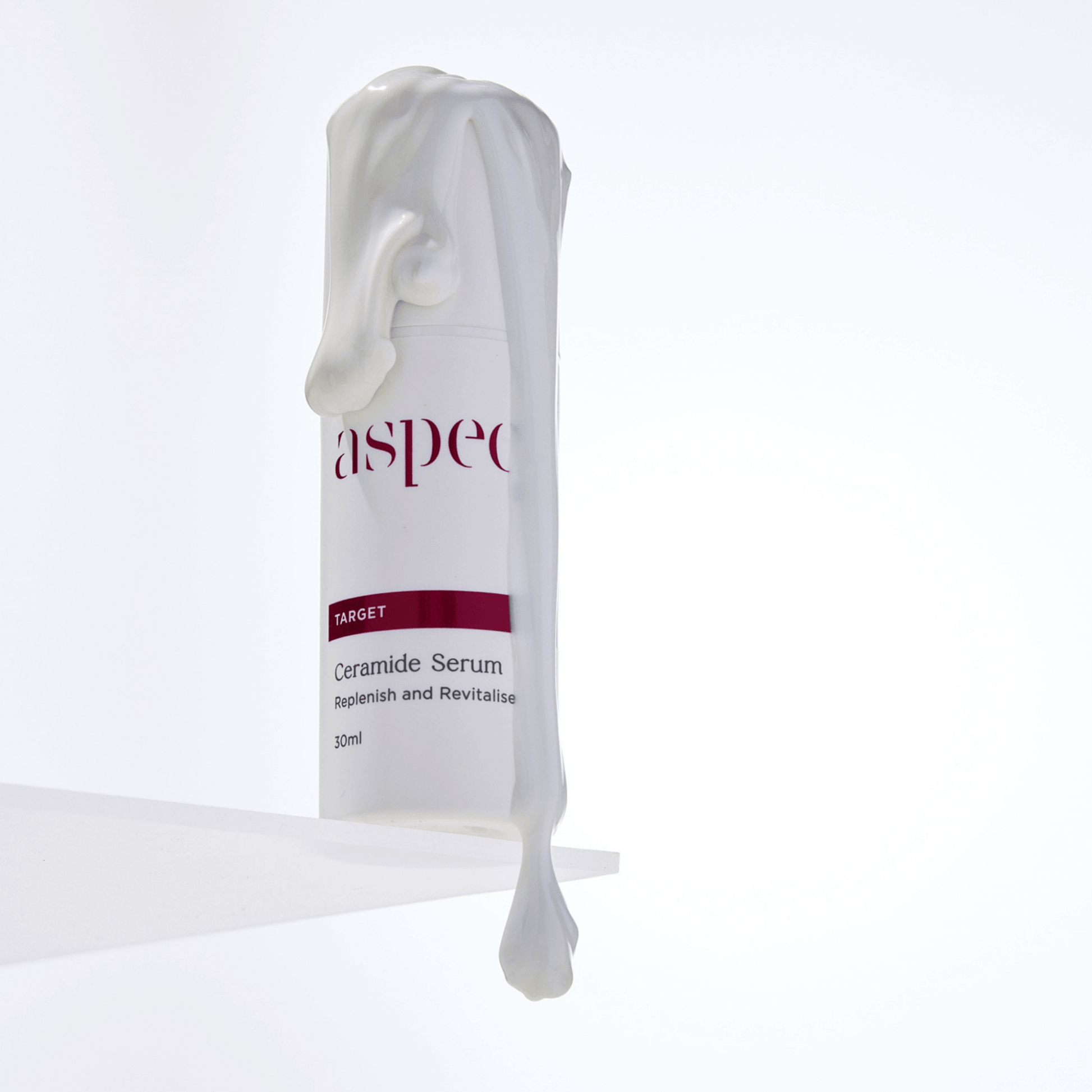 Ceramide Serum Aspect Dr skincare with serum dripping off lid of product on white background