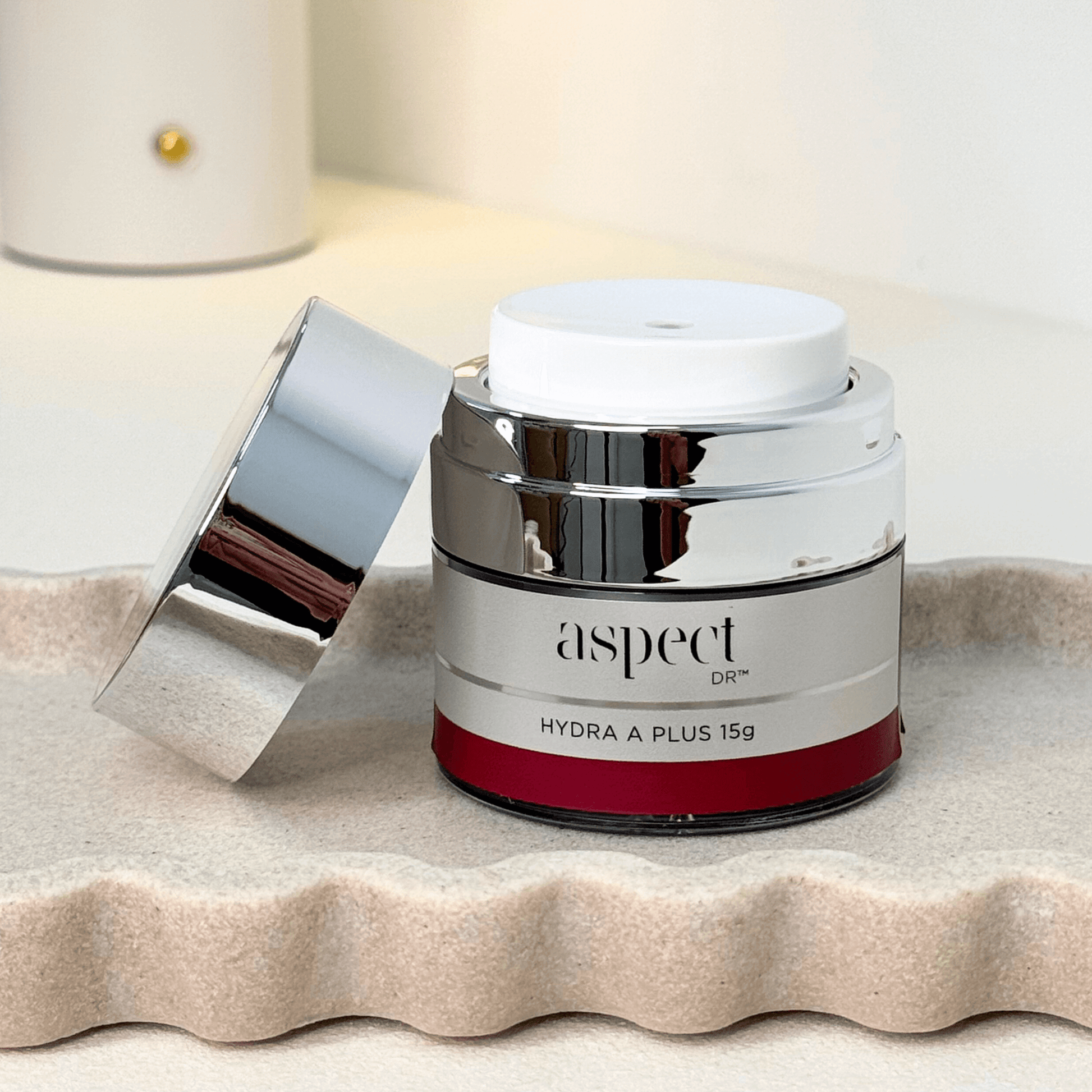 Hydra A plus 15g Aspect Dr with lid off on neutral background