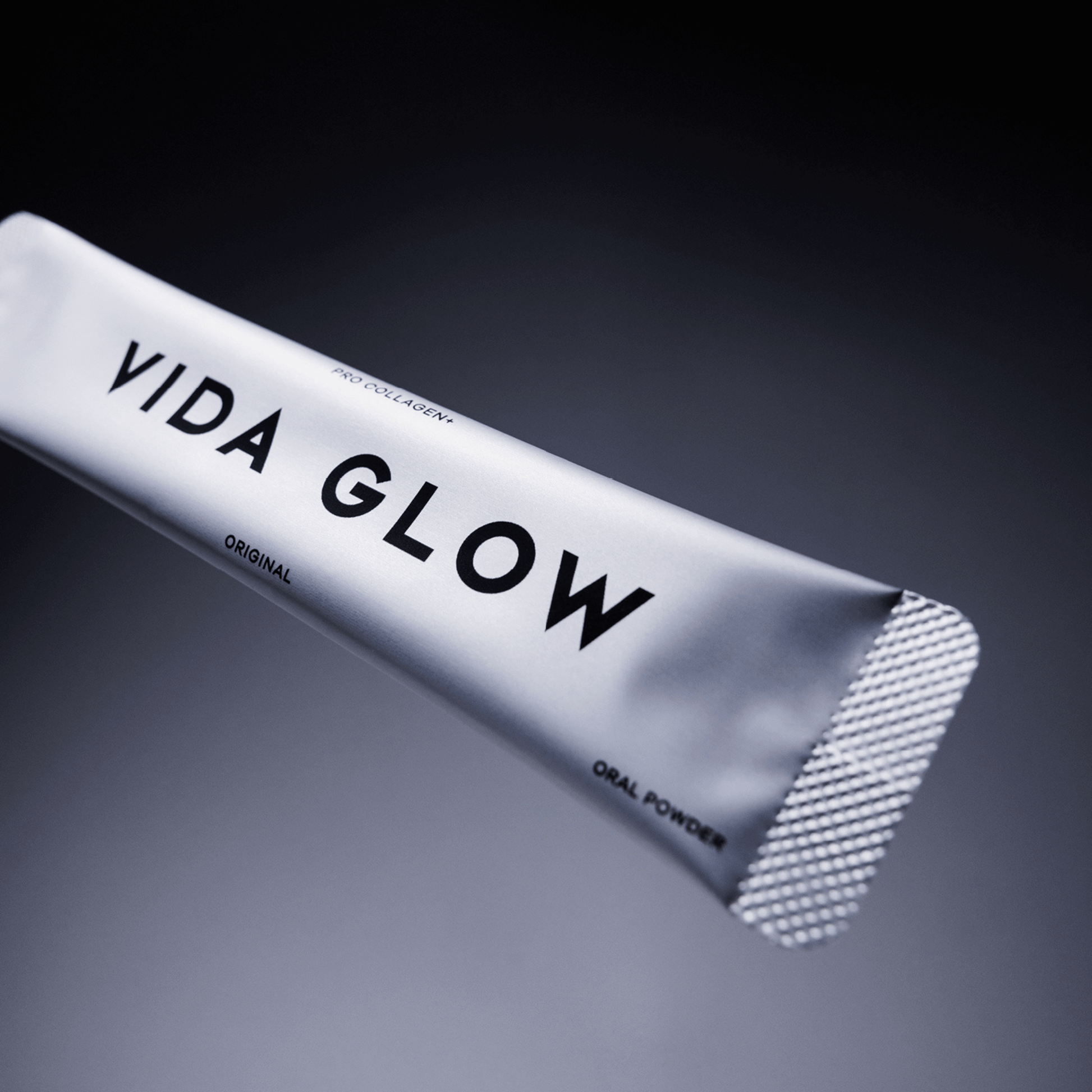 Vida Glow pro collagen plus sachet on grey background