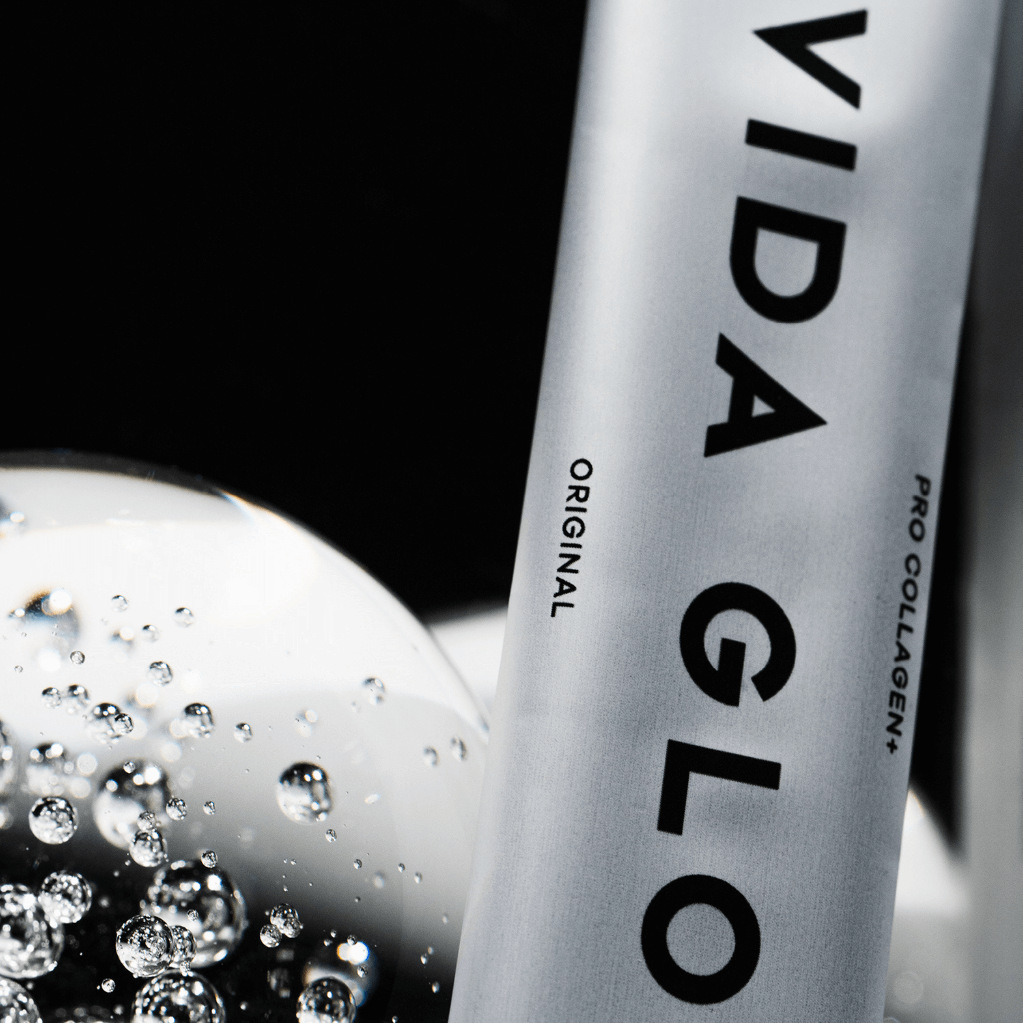 Vida glow pro collagen plus up close sachet on black background