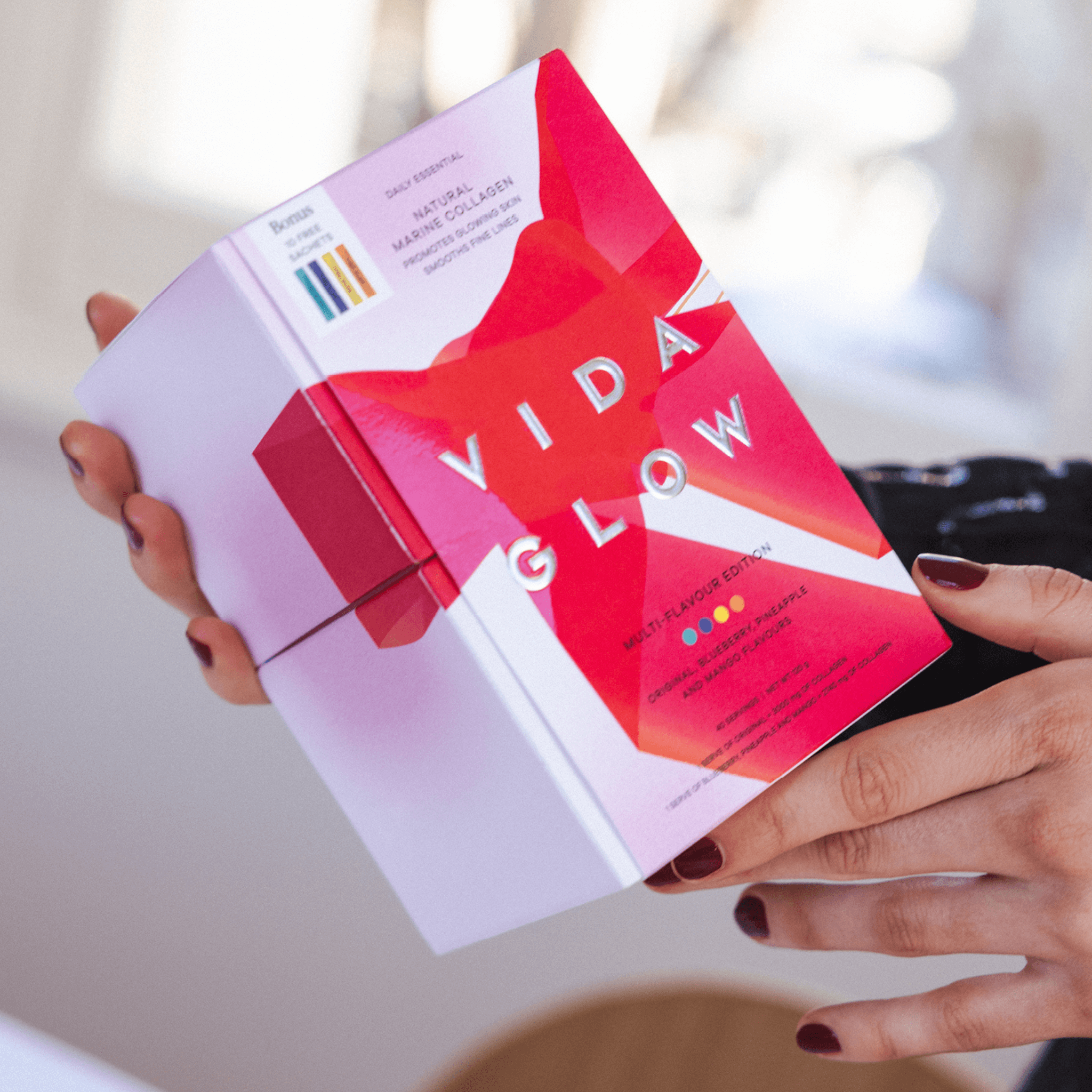 Vida Glow collagen extra sachet multi pack box held in hands