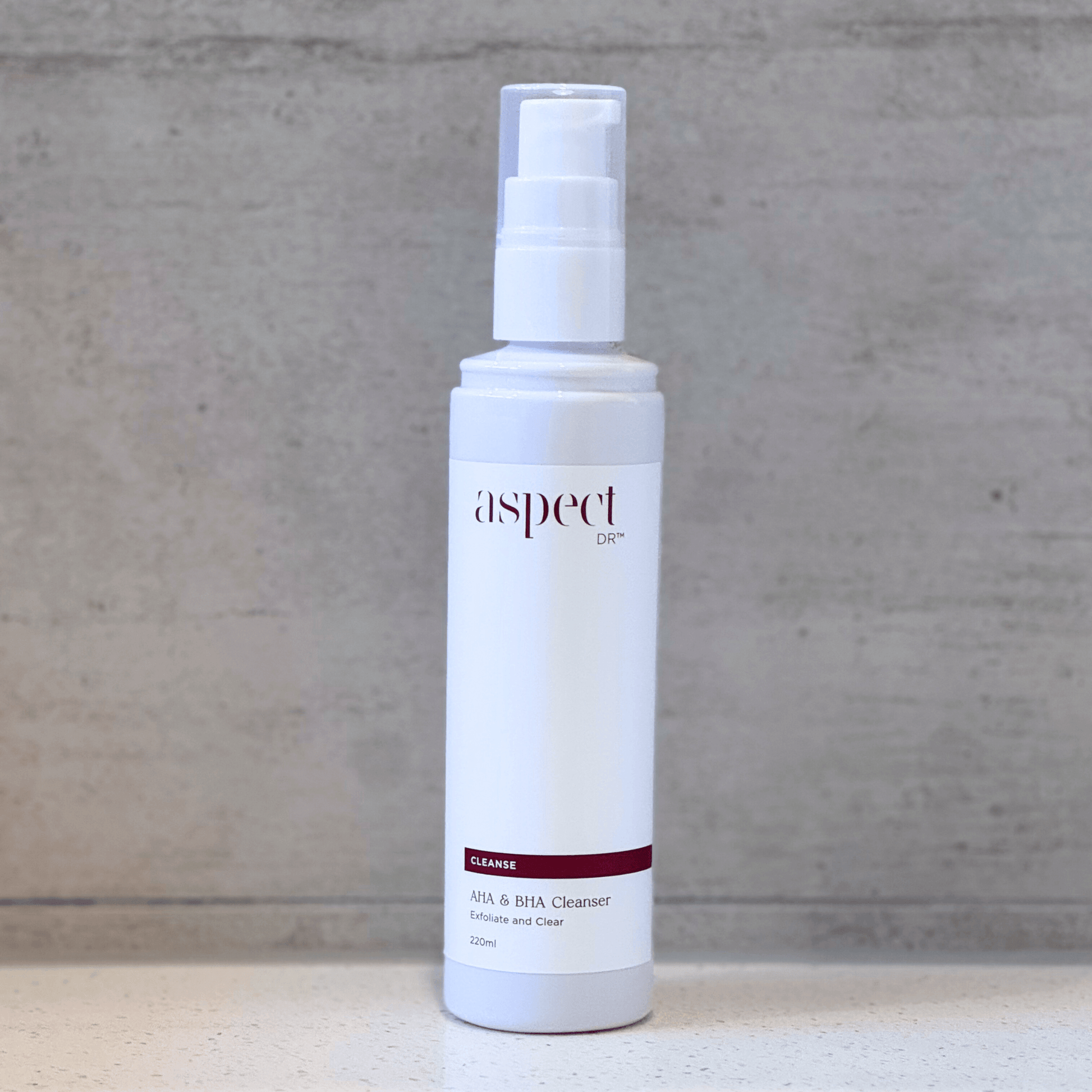 AHA BHA Cleanser Aspect Dr pump top on neutral background