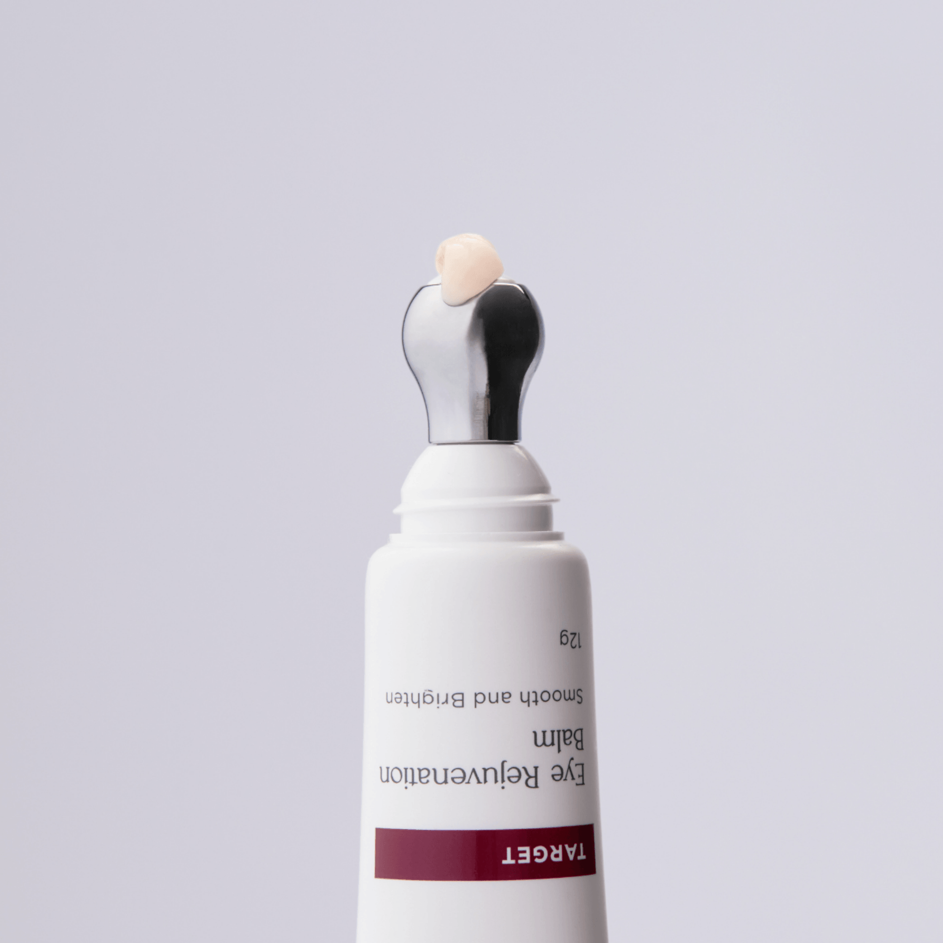 Aspect Dr Target Eye Rejuvenation Smooth and Brighten eye cream in a white squeeze tube with a metallic silver applicator tip, shown on a light grey background.