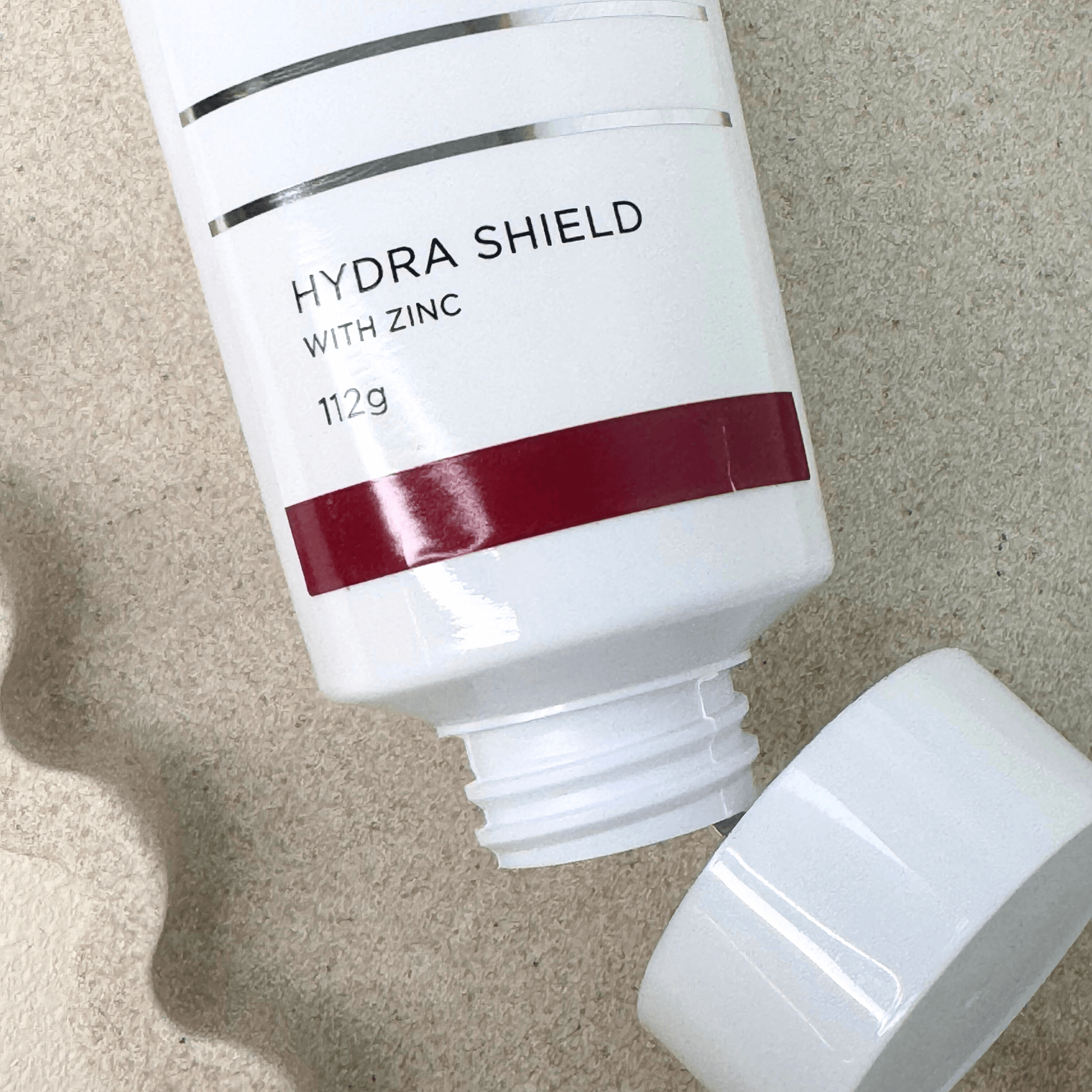 Aspect Dr Hydra Shield 112g top of product on sand background