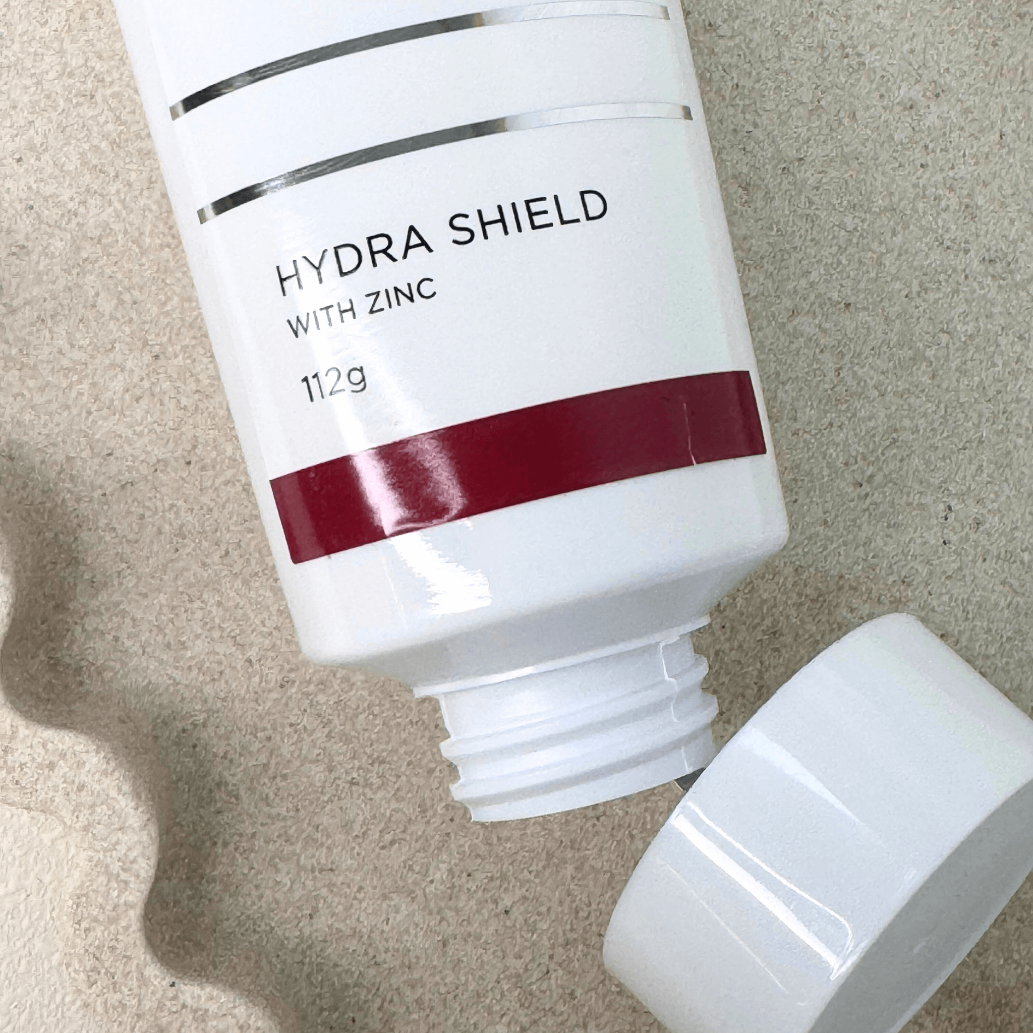 Aspect Dr Hydra Shield 112g top of product on sand background