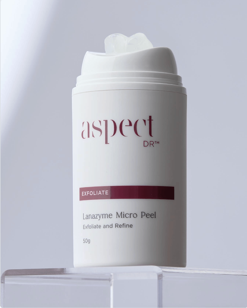 Skincare product container labeled 'Aspect Dr Lanazyme Micro Peel' on a light grey background