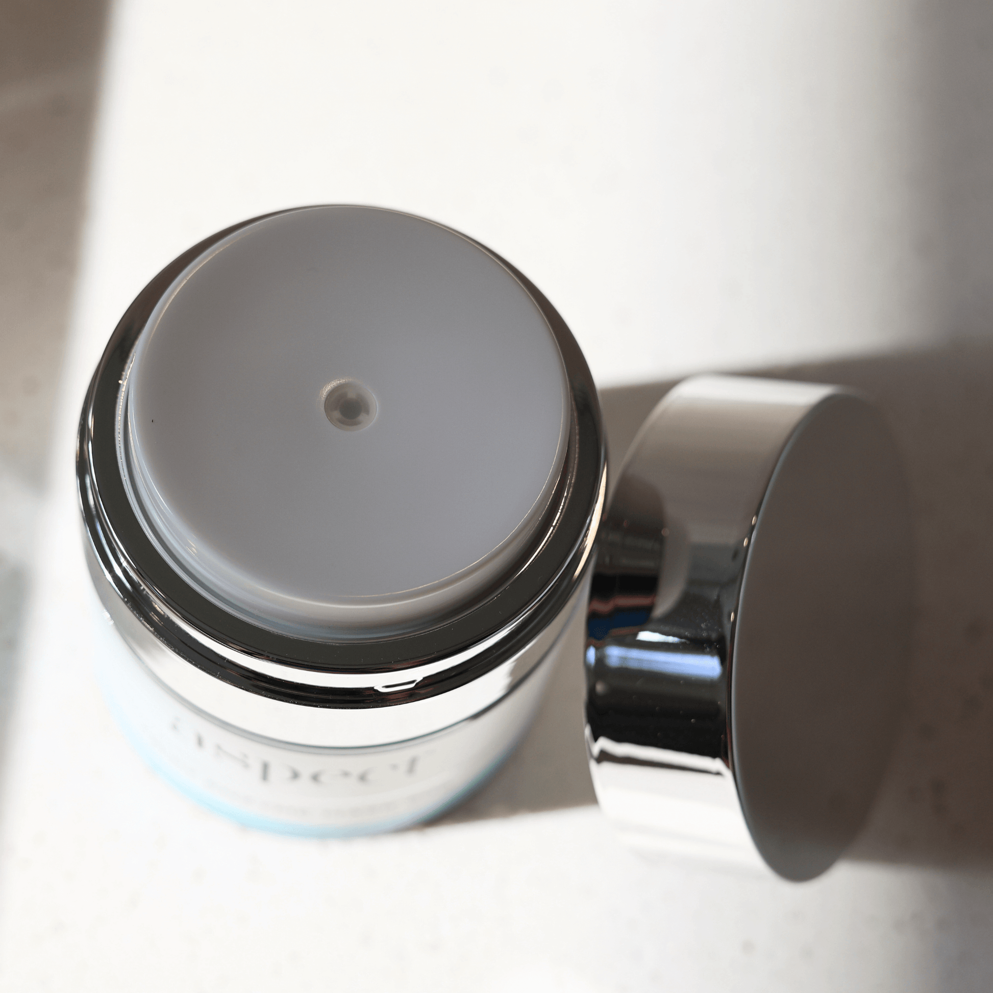 Close-up of Aspect fruit enzyme mask pump on a white background