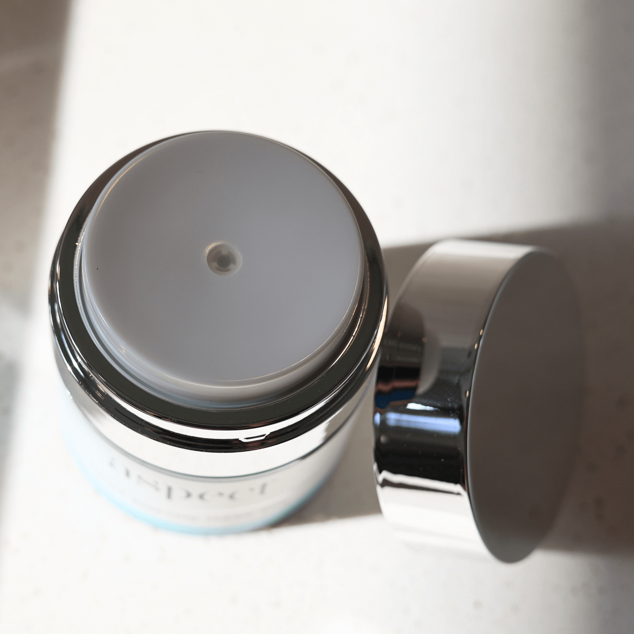 Close-up of Aspect fruit enzyme mask pump on a white background