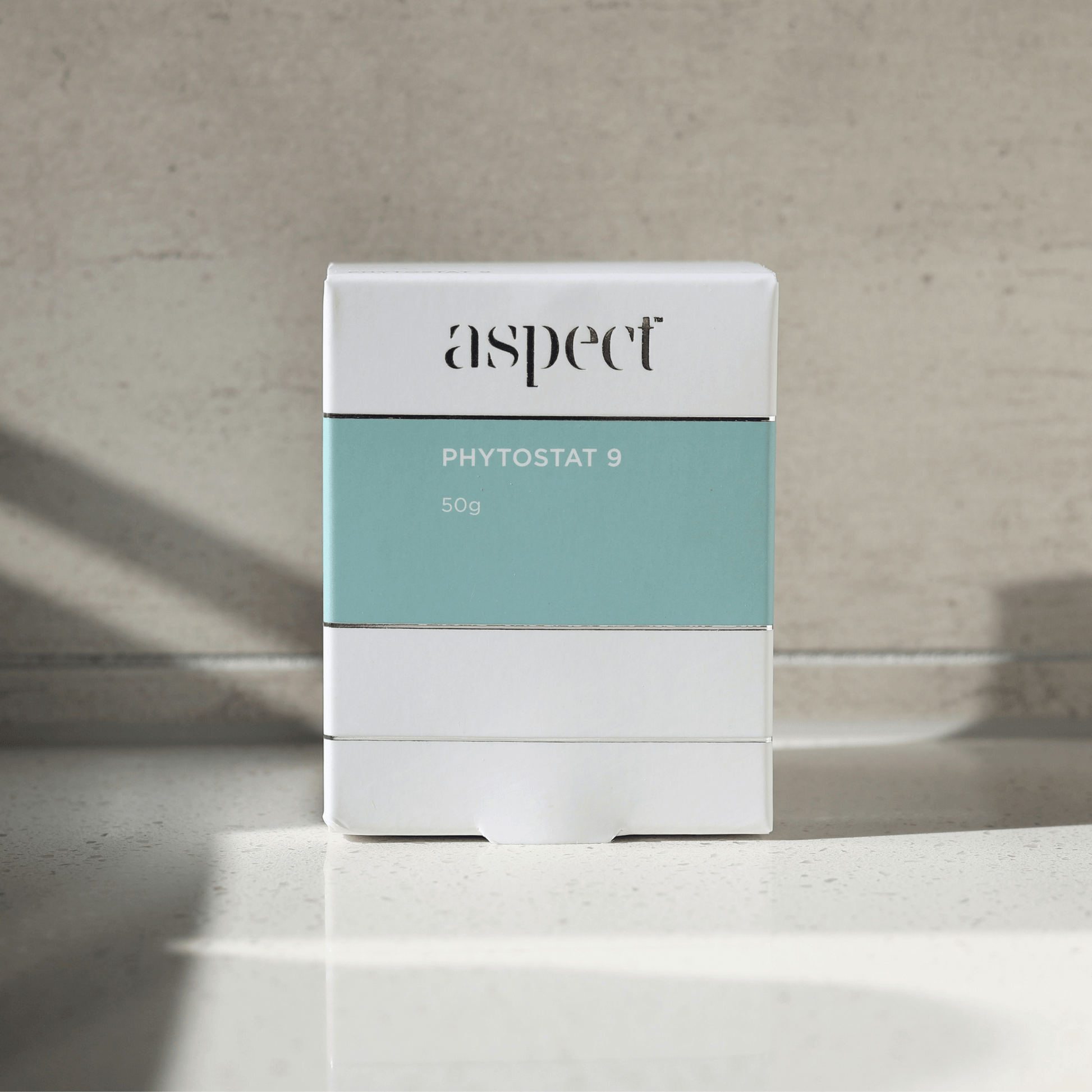 Product packaging with 'aspect phytostat 9' branding on a neutral background