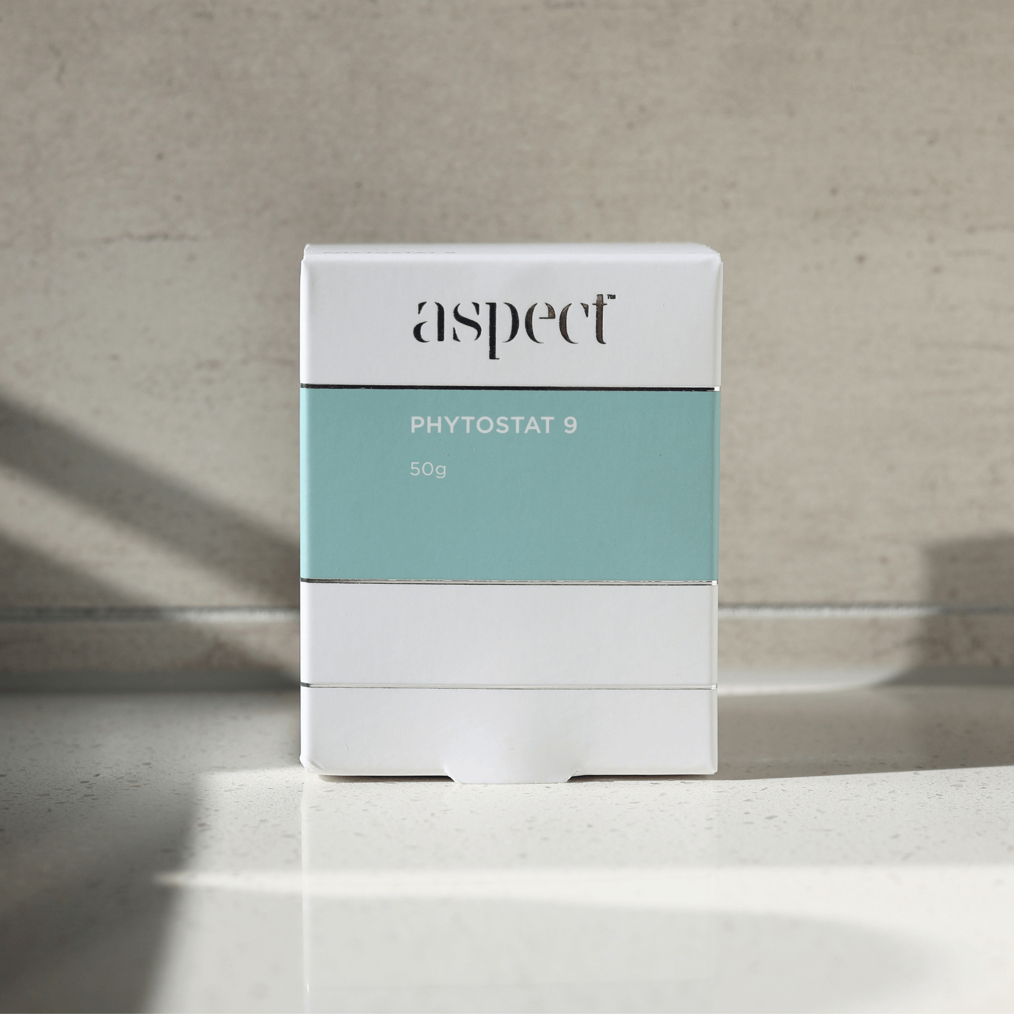 Product packaging with 'aspect phytostat 9' branding on a neutral background