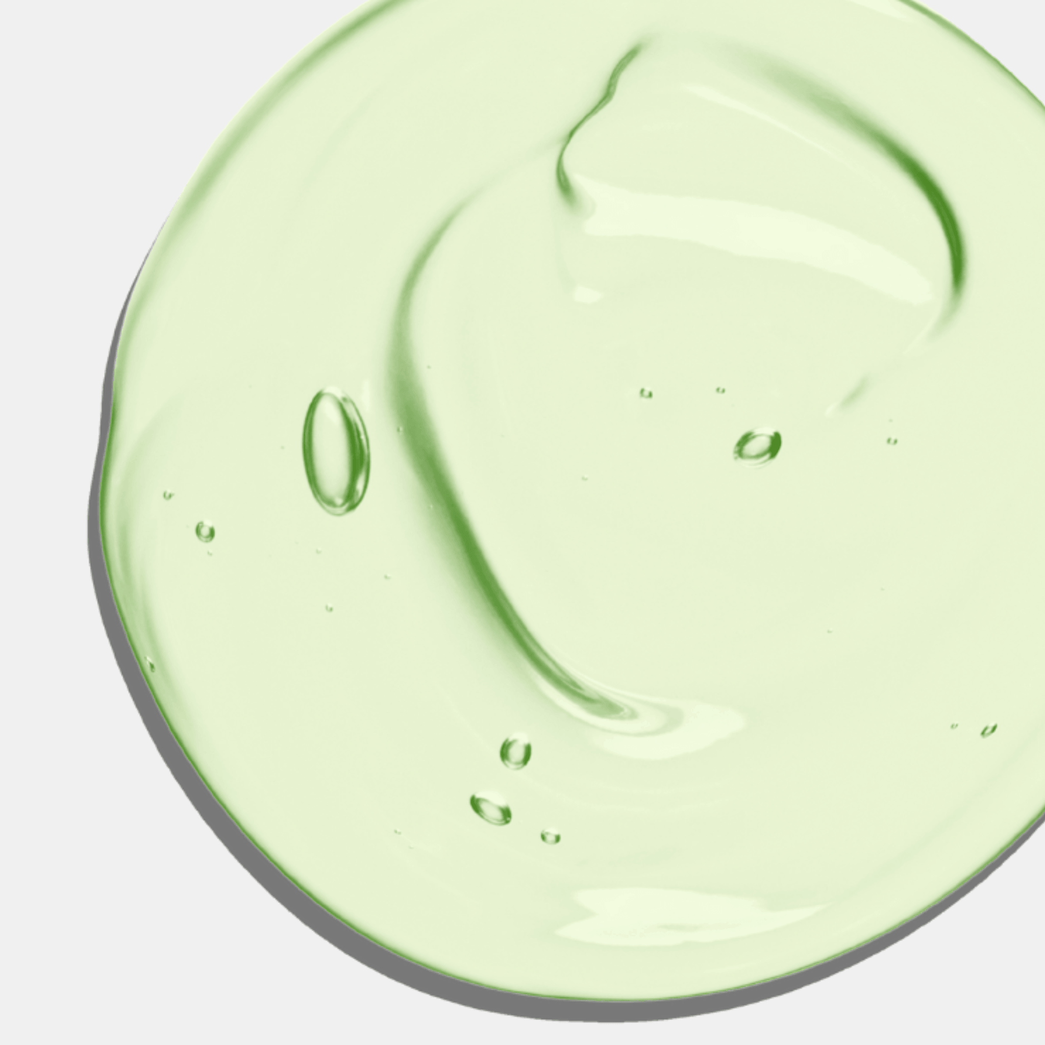 Close-up of Aspect green cleanser on a white background