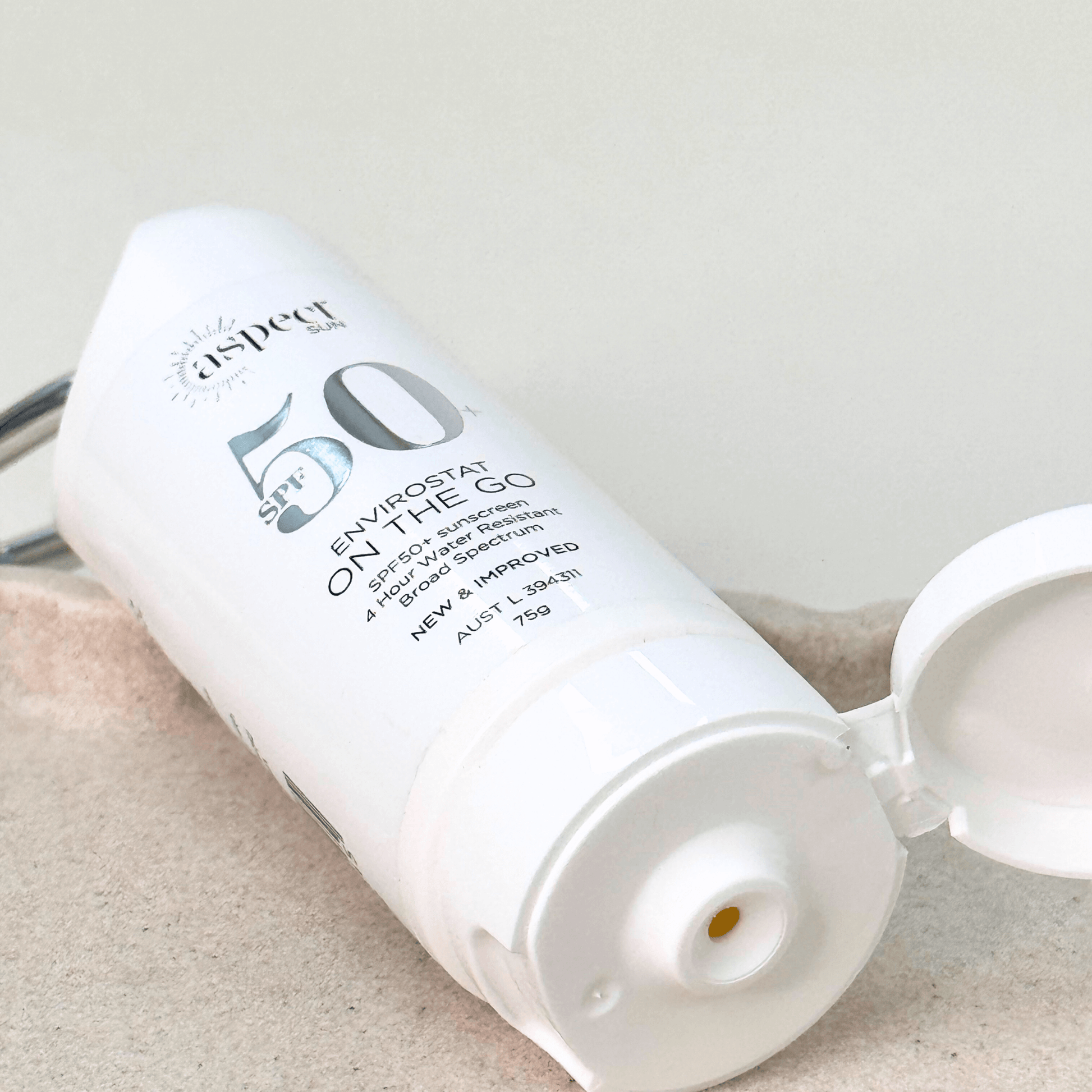 Aspect Sun SPF50 close up of sunscreen product and cap open