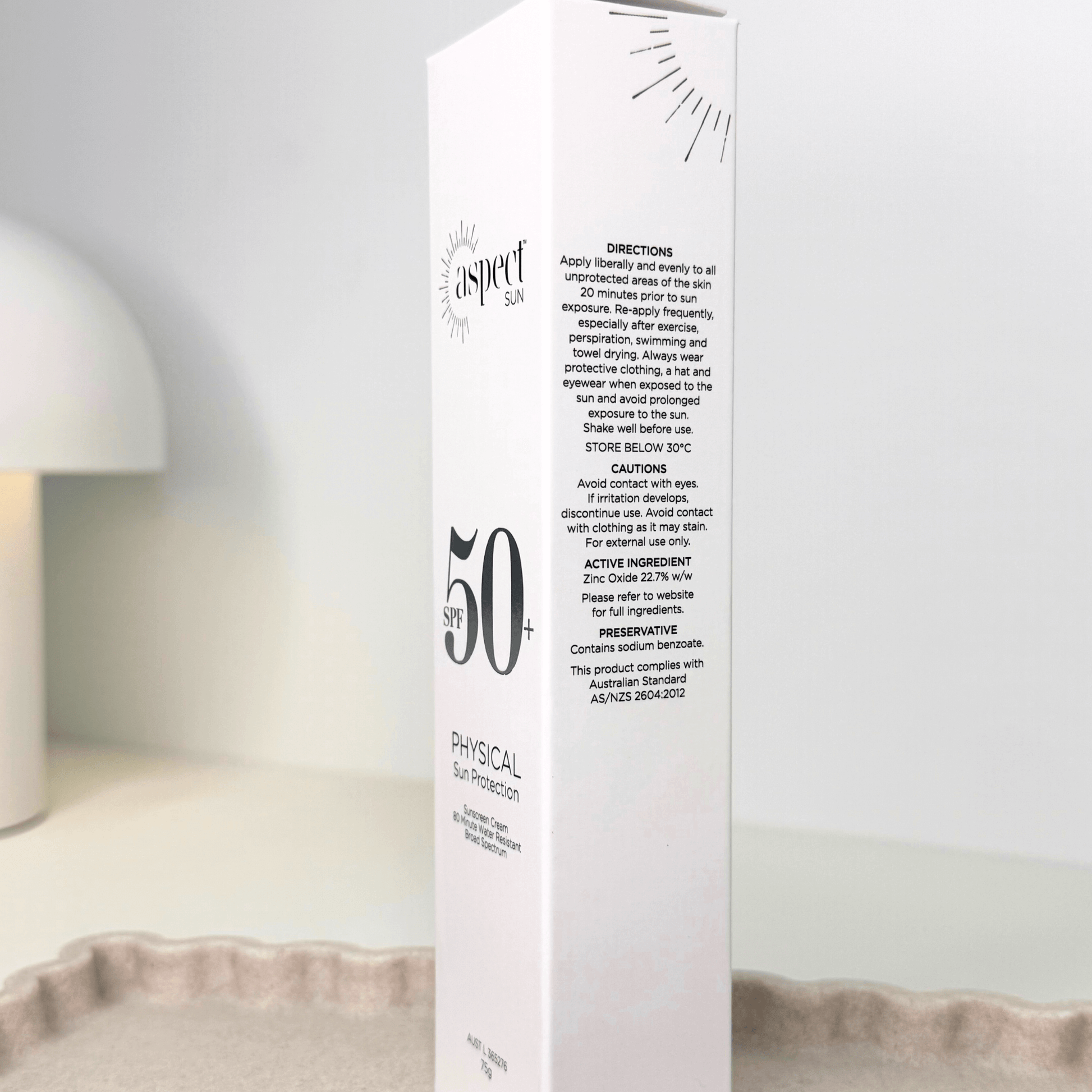 Aspect Sun packaging with SPF 50+ product box on a neutral background