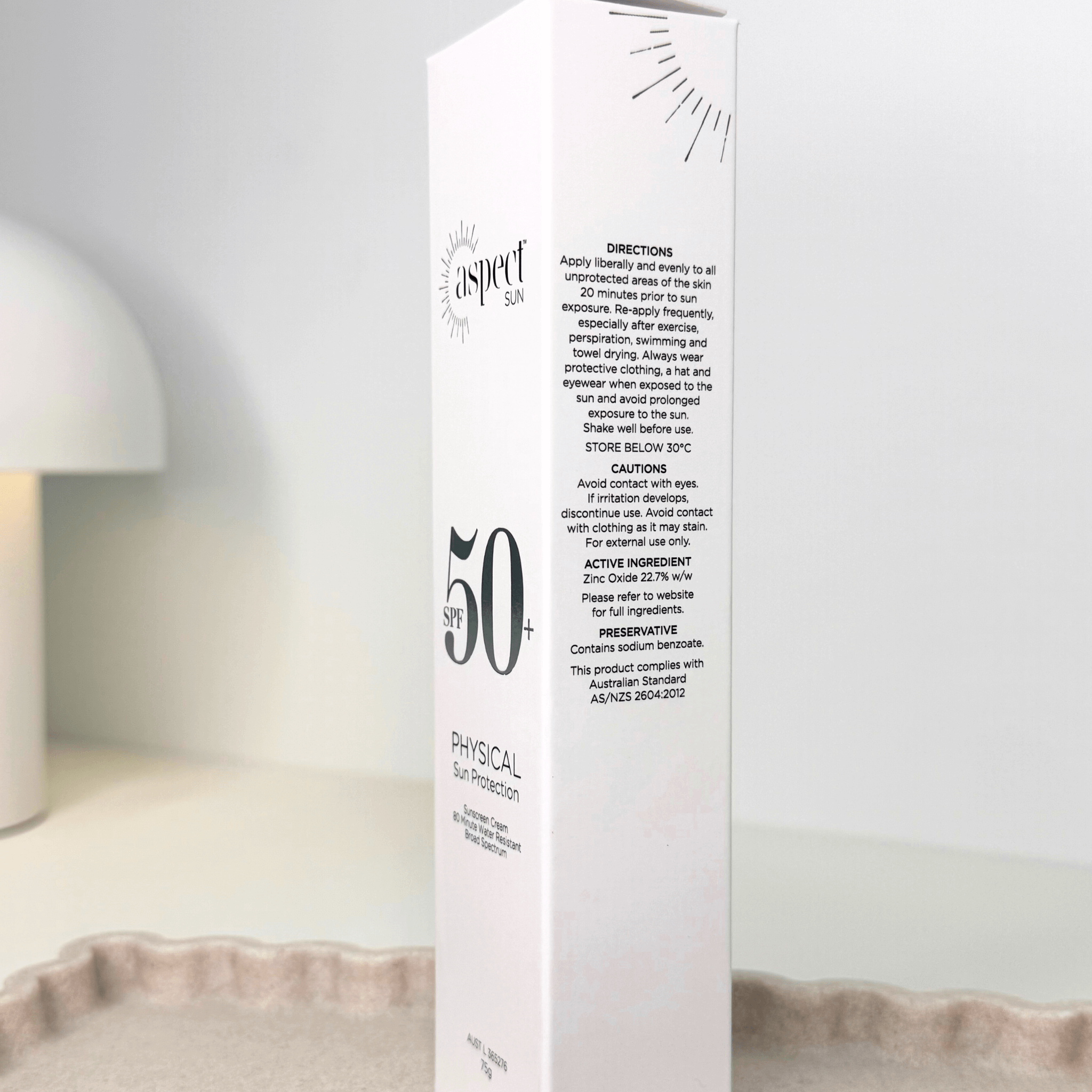 Aspect Sun packaging with SPF 50+ product box on a neutral background
