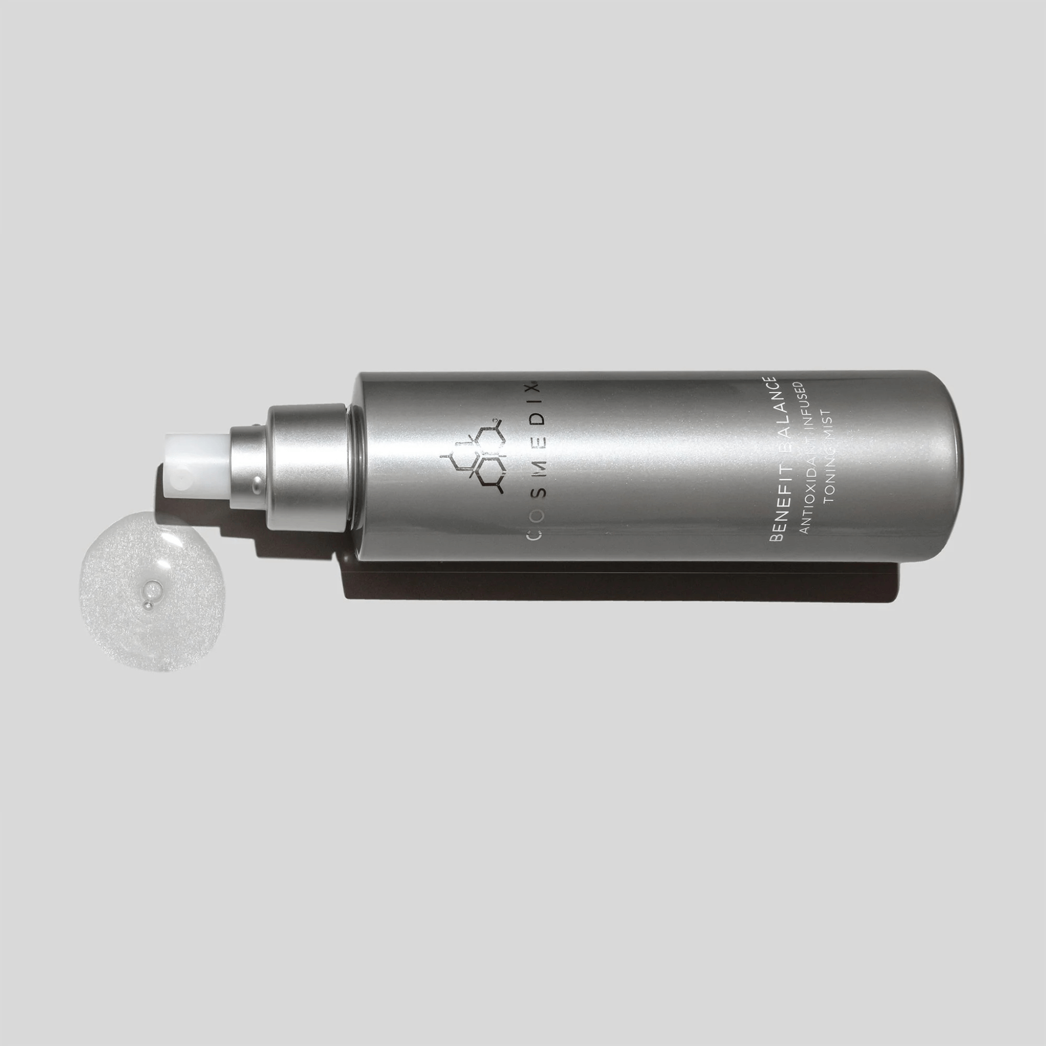 Benefit balance Cosmedix skincare bottle on a light grey background