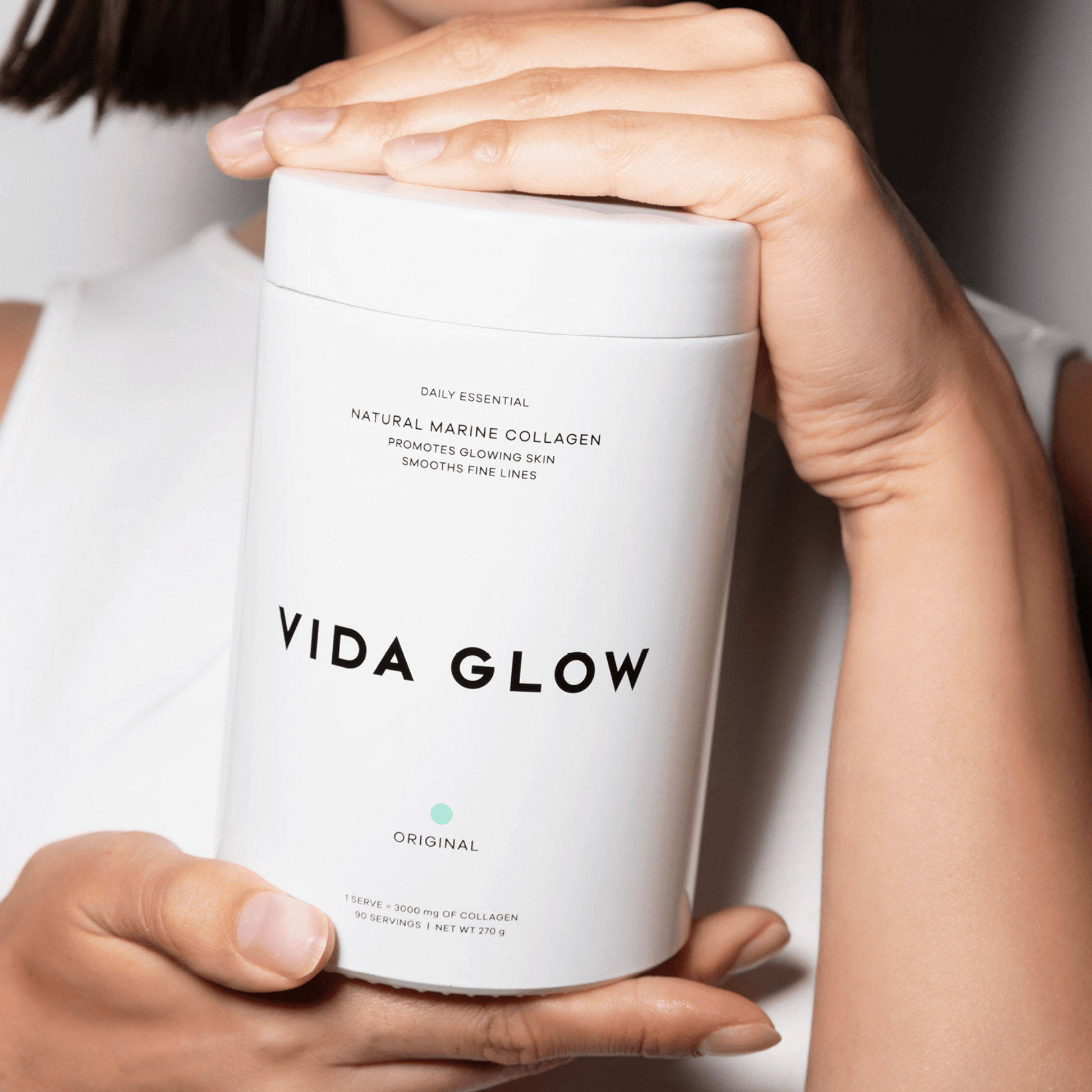 270g glass jar vida glow handheld by model