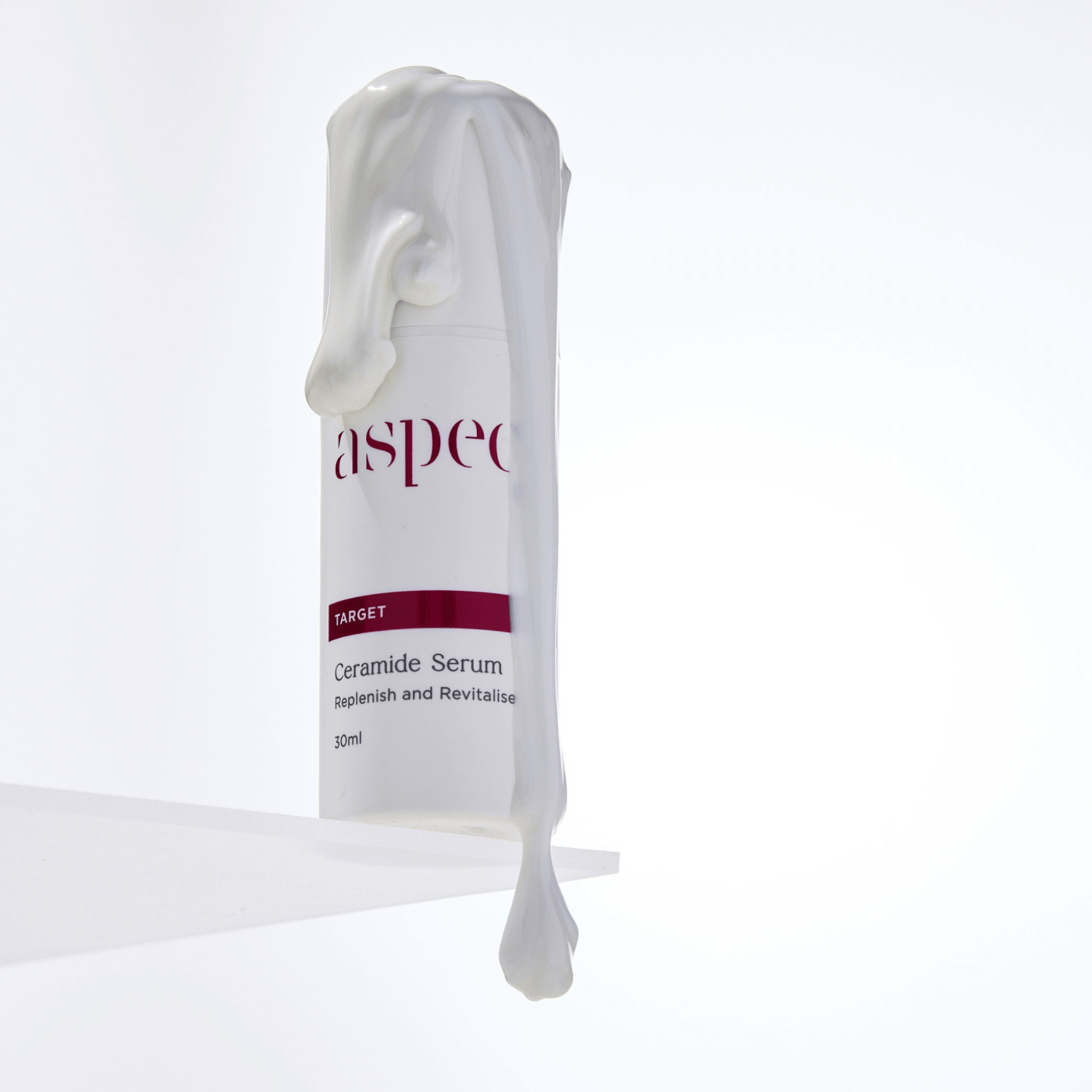 Ceramide Serum Aspect Dr skincare with serum dripping off lid of product on white background