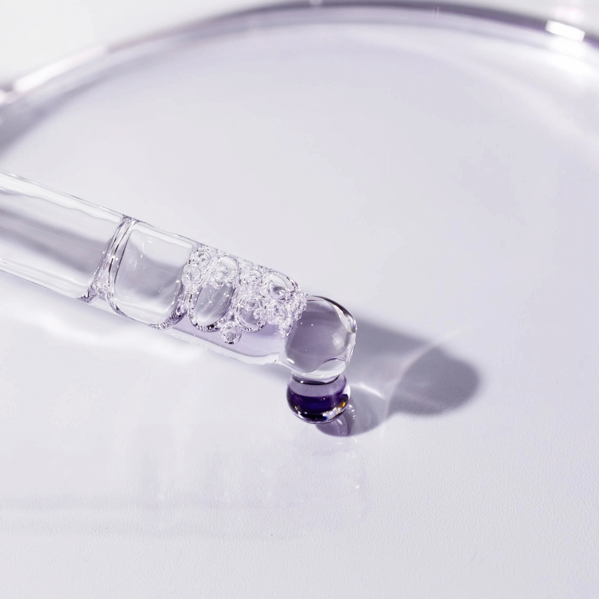 Cosmedix Bakuchiol dropper with a drop of liquid on a white background