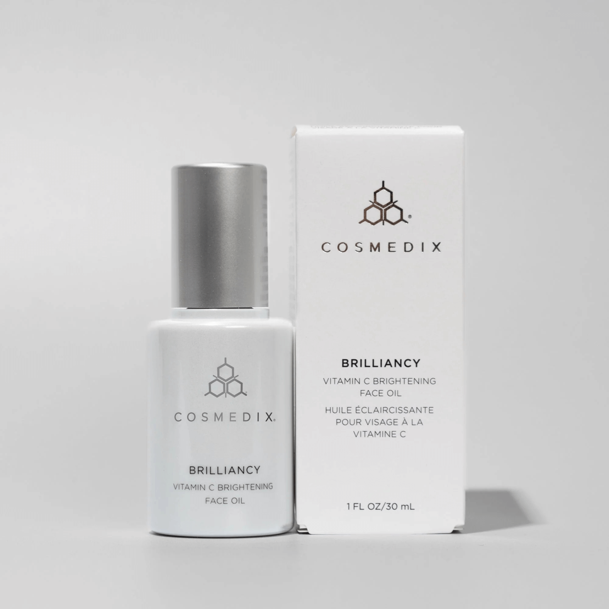 Cosmedix BrillianCy Vitamin C Brightening Face Oil with packaging on a light grey background