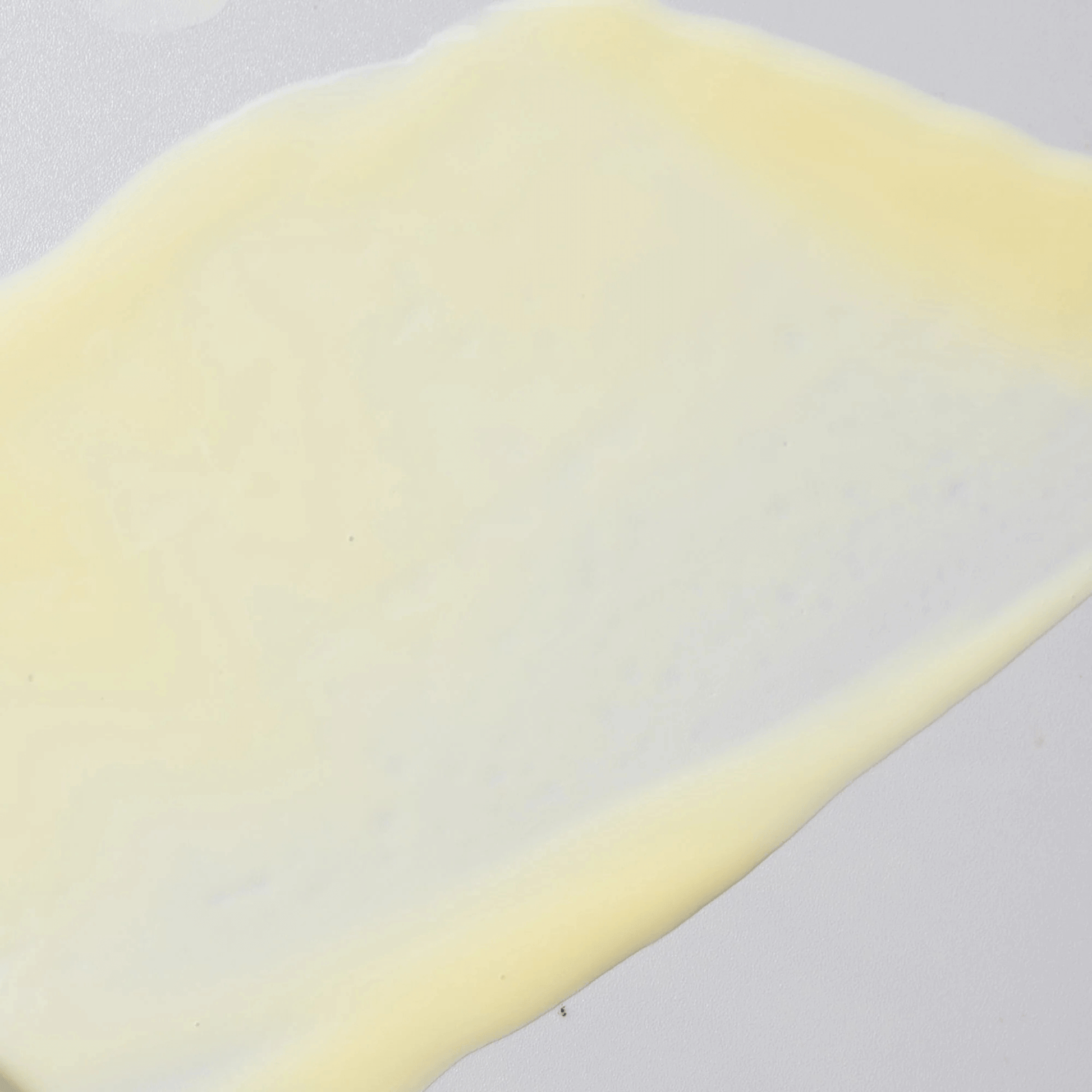 Close-up of Cosmedix Define skincare texture on a grey background