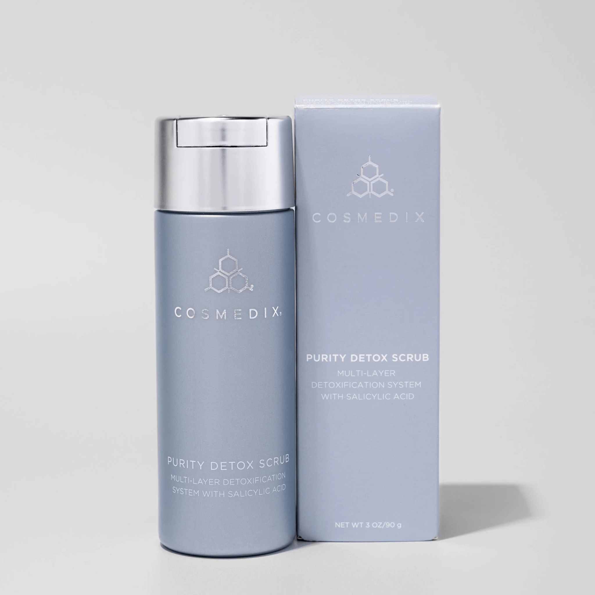 Cosmedix Purity Detox Scrub bottle and packaging on a light grey background