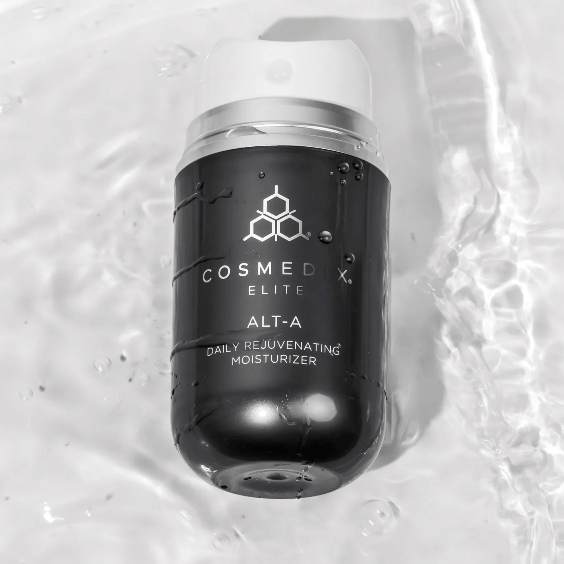 Cosmedix Elite ALT-A moisturiser bottle on a textured white background