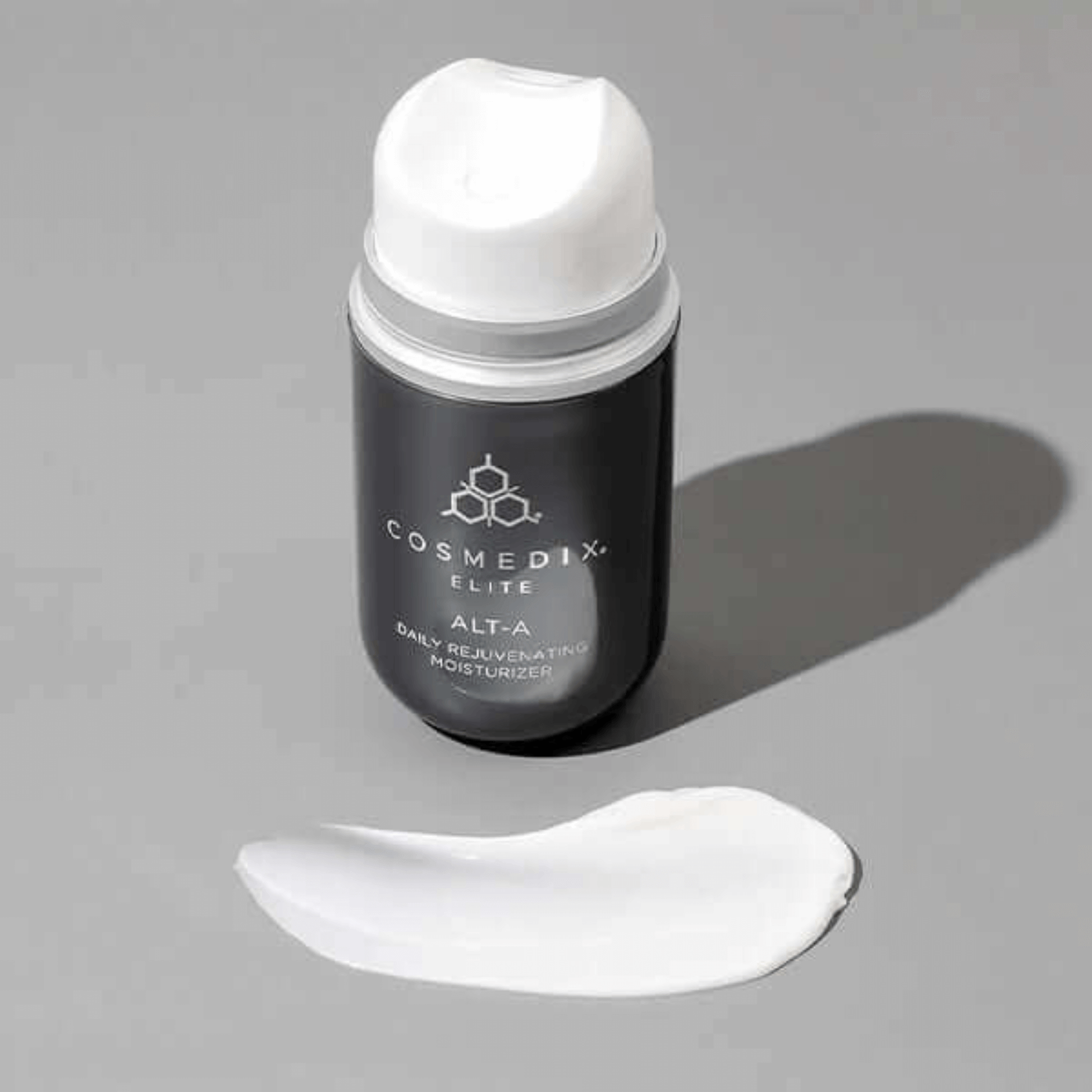 Cosmedix Elite Alt-A moisturiser on a grey background