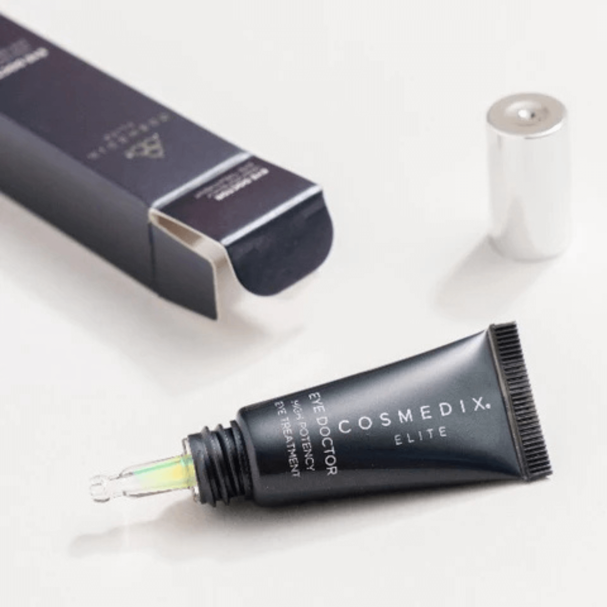 Cosmedix Elite eye cream tube on a white background