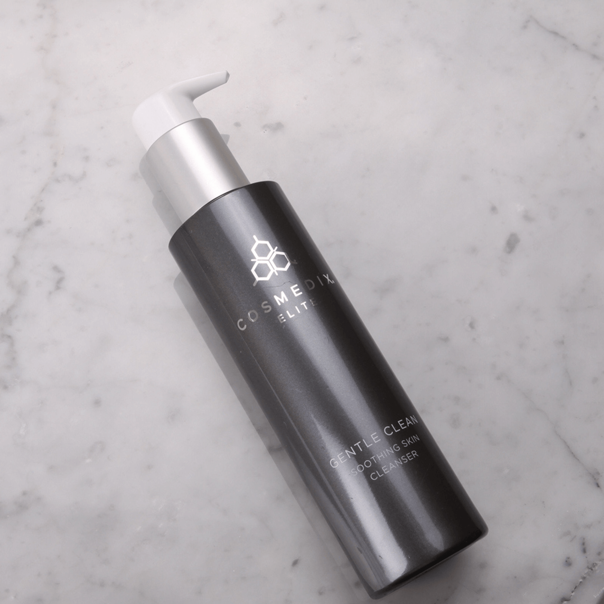 Cosmedix Elite Gentle Cleanser laying on white marble