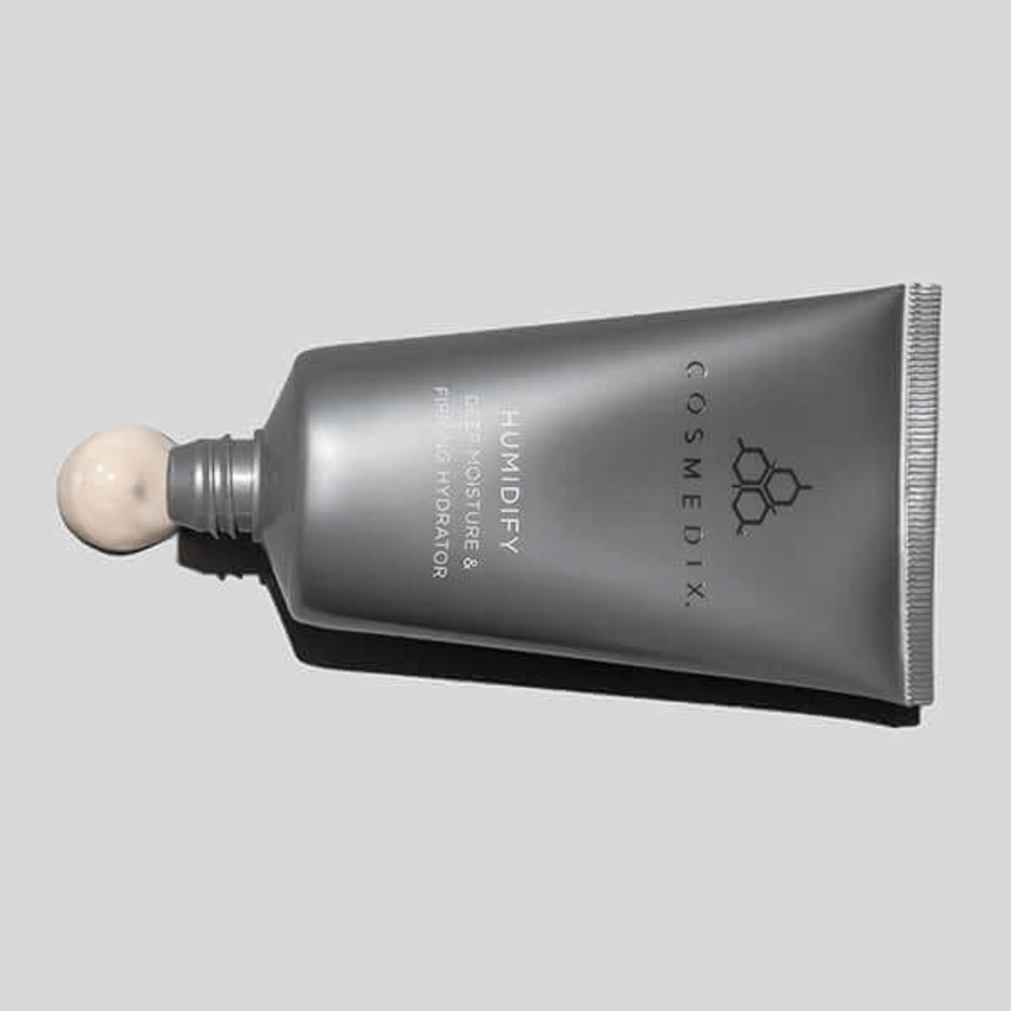 Cosmedix humidify moisturiser on a grey background