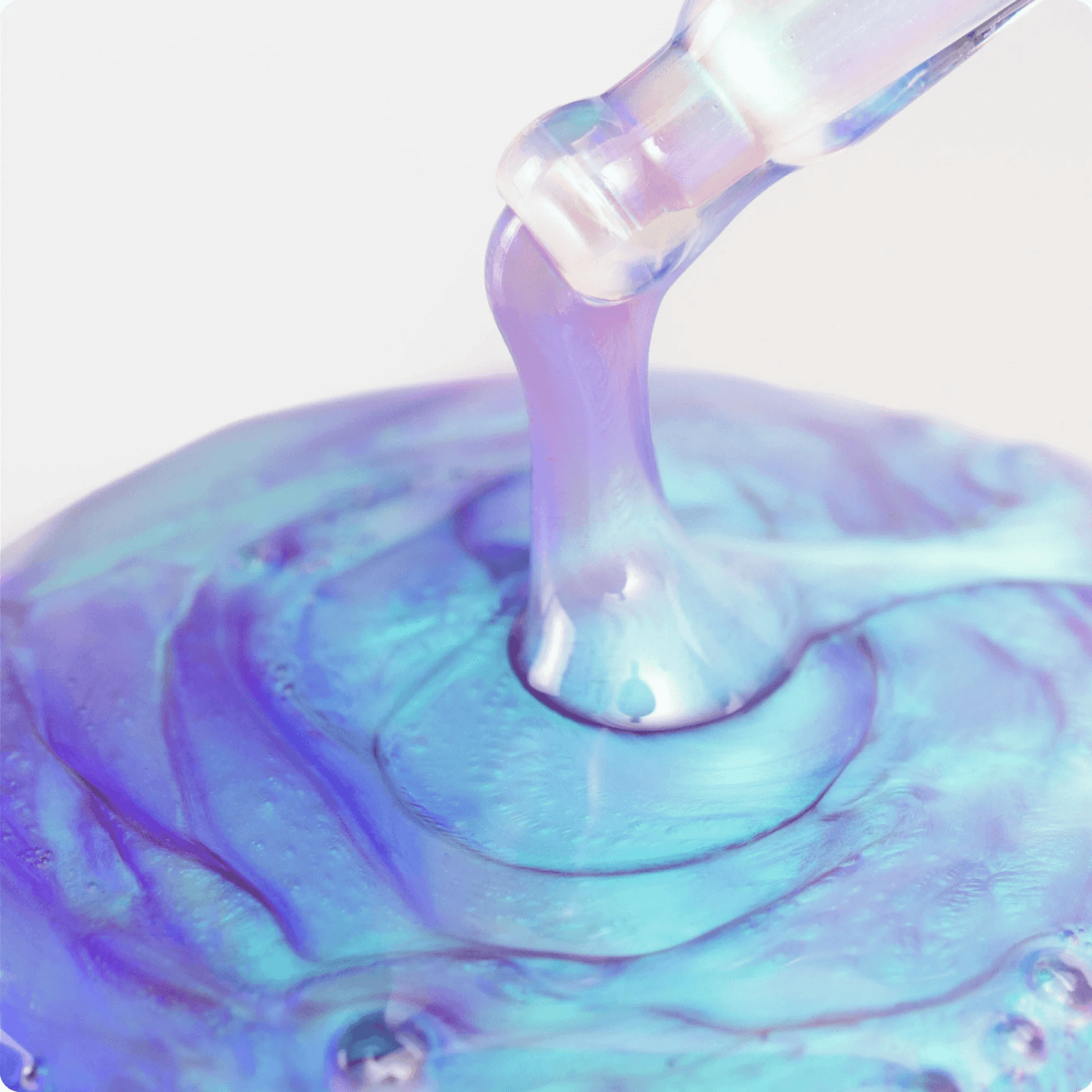Iridescent opti crystal liquid being poured into a container with a swirling pattern