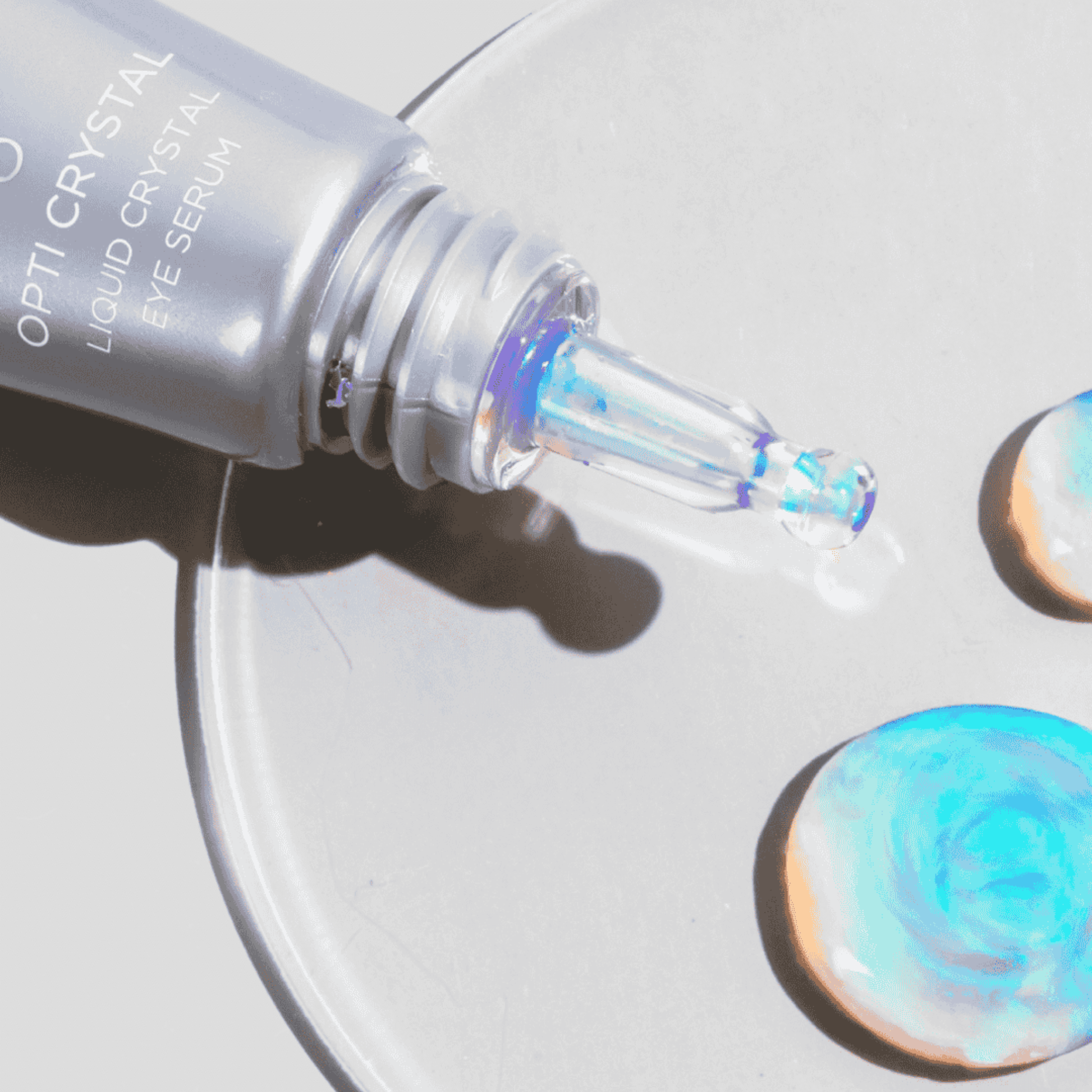 Opti Crystal liquid crystal eye serum dropper on a white background
