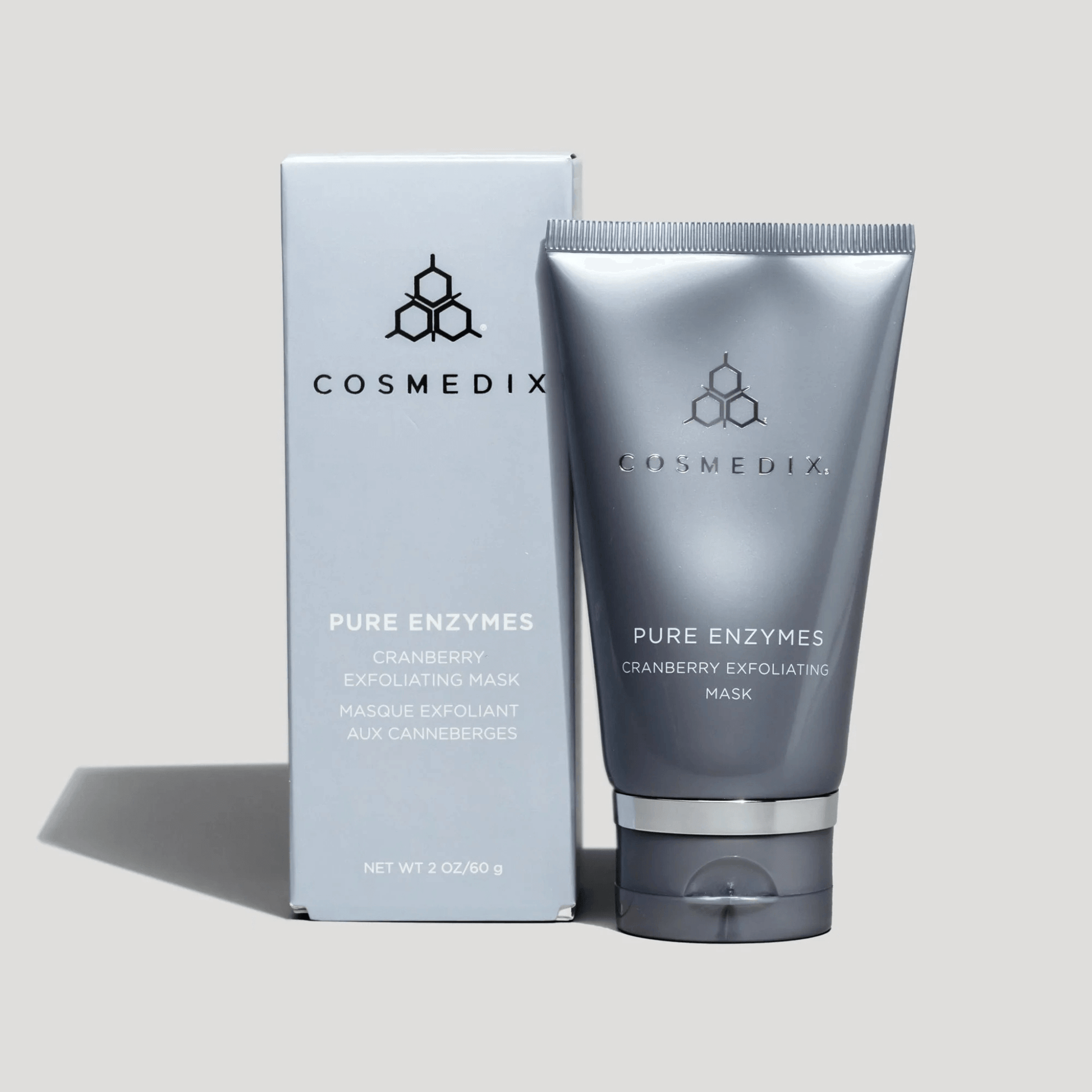 Cosmedix Pure Enzymes Cranberry Exfoliating Mask with packaging on a light grey background