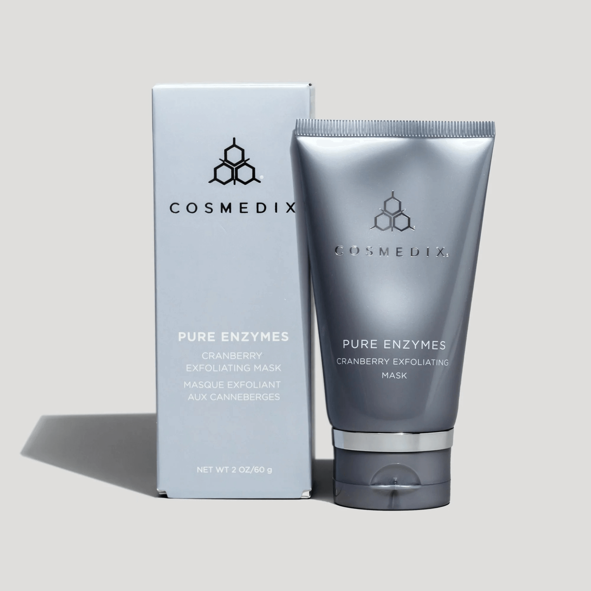 Cosmedix Pure Enzymes Cranberry Exfoliating Mask with packaging on a light grey background