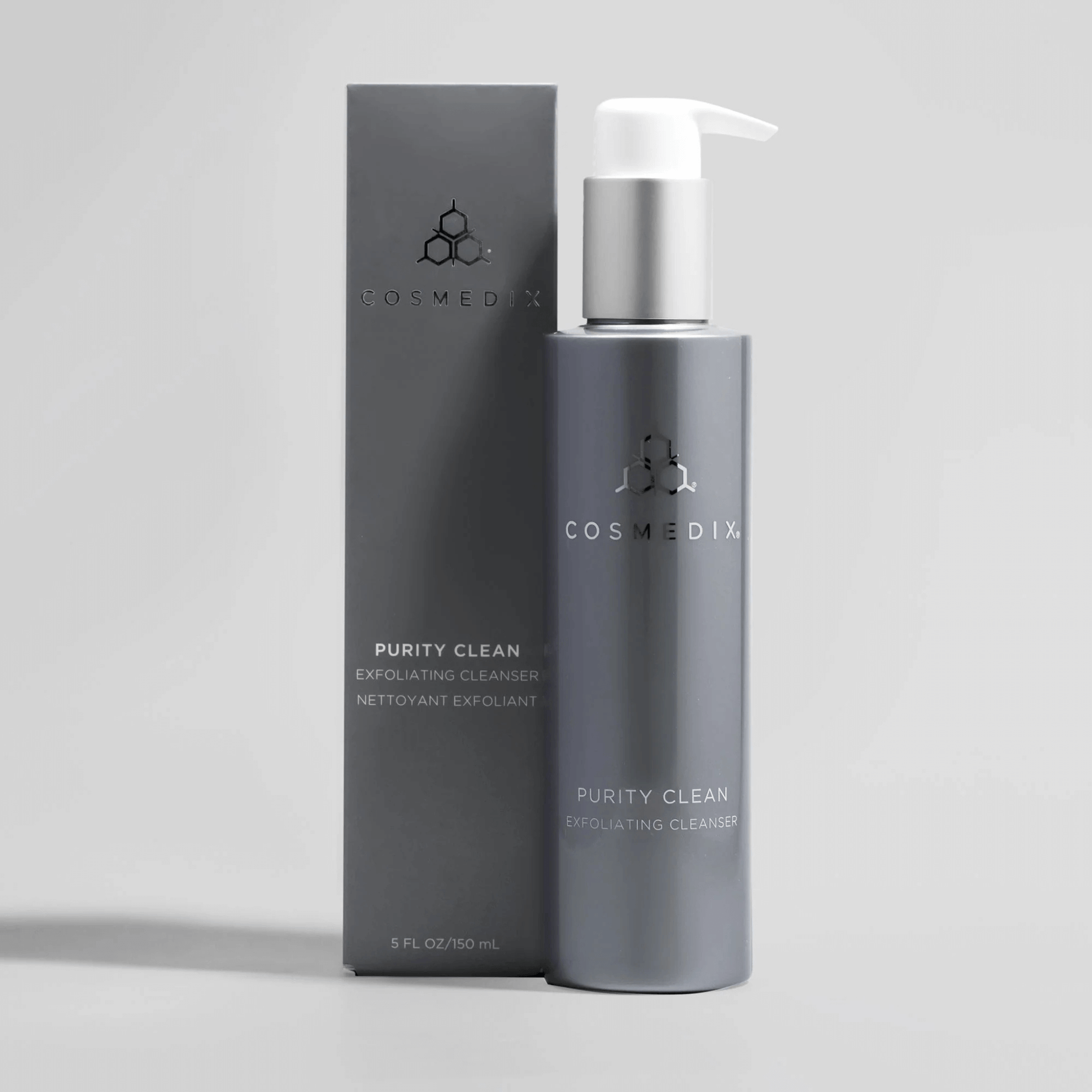 Cosmedix Purity Clean Exfoliating Cleanser bottle and packaging on a light grey background
