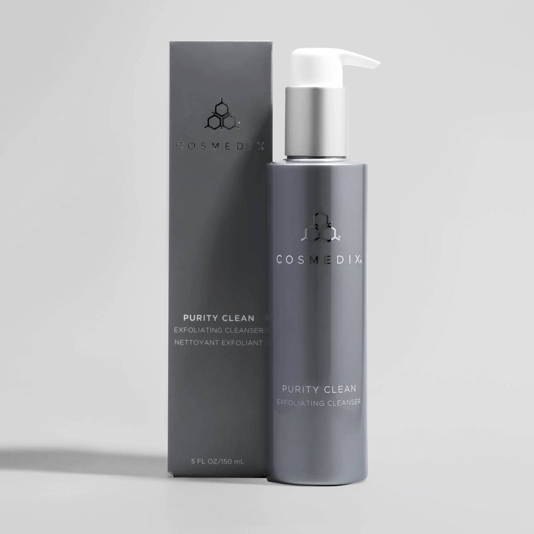 Cosmedix Purity Clean Exfoliating Cleanser bottle and packaging on a light grey background