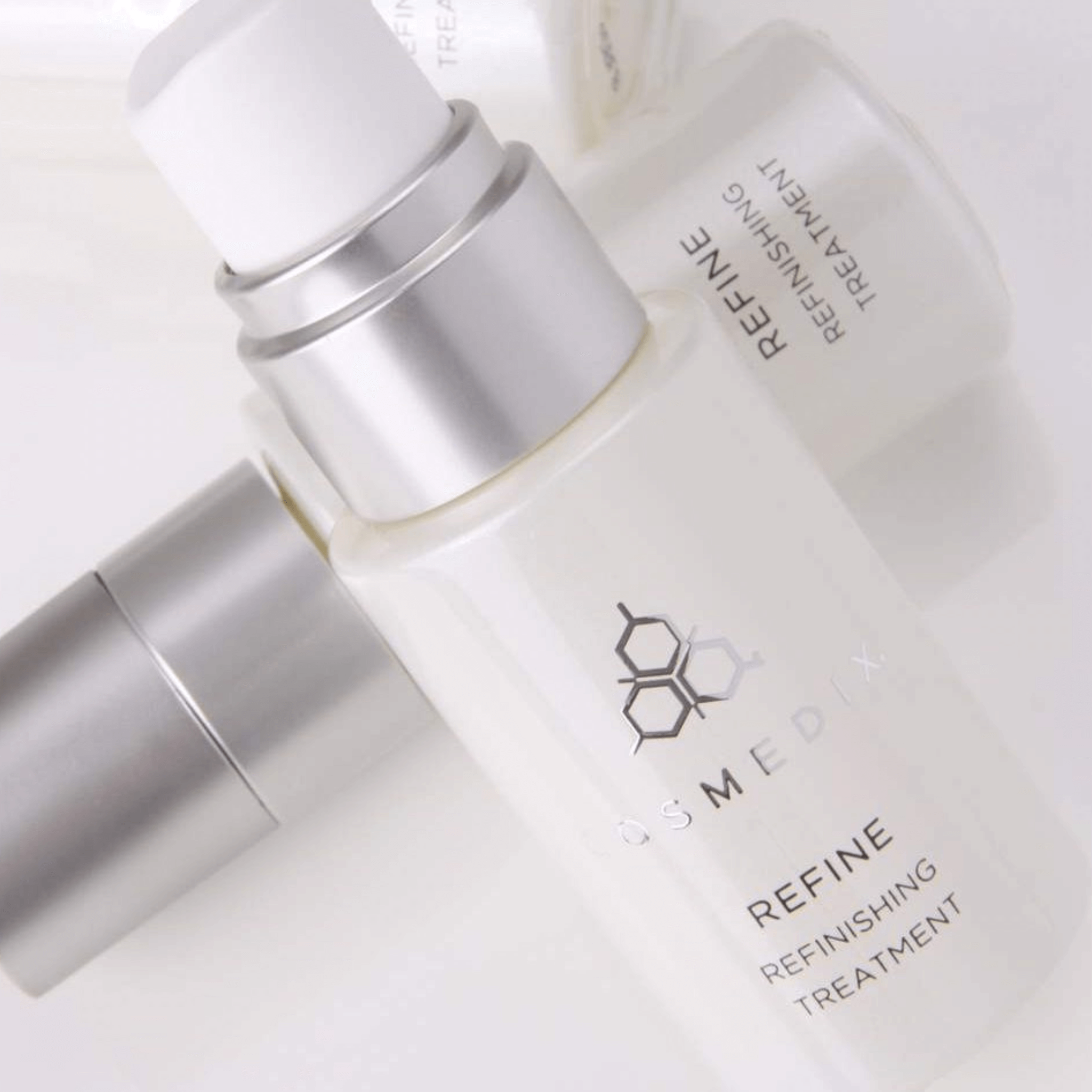 Cosmedix Refine Refinishing Treatment bottles on white backgorund
