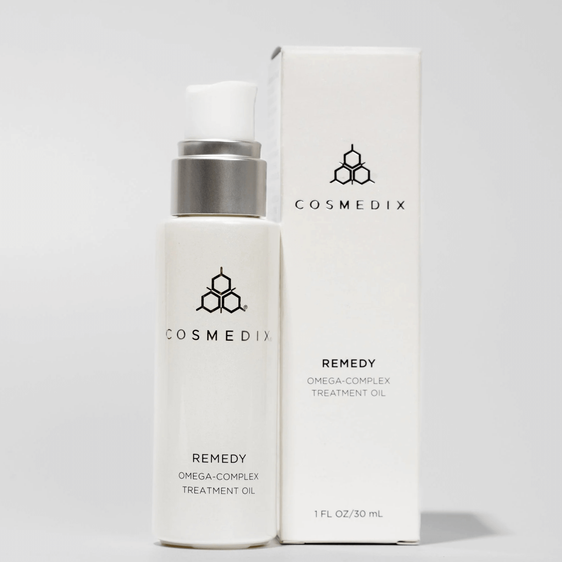 Cosmedix Remedy Omega-Complex Treatment Oil bottle and box on a light grey background