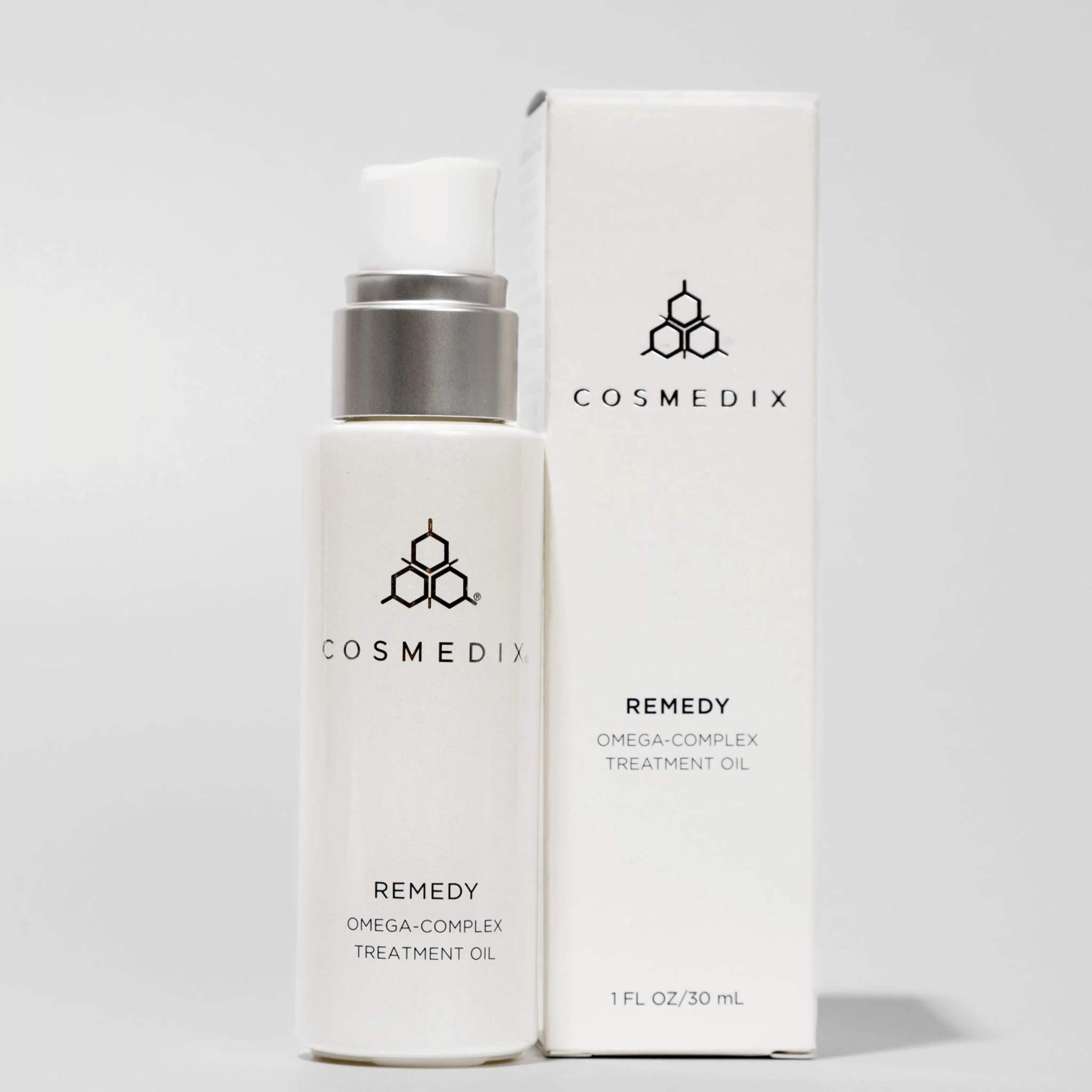 Cosmedix Remedy Omega-Complex Treatment Oil bottle and box on a light grey background