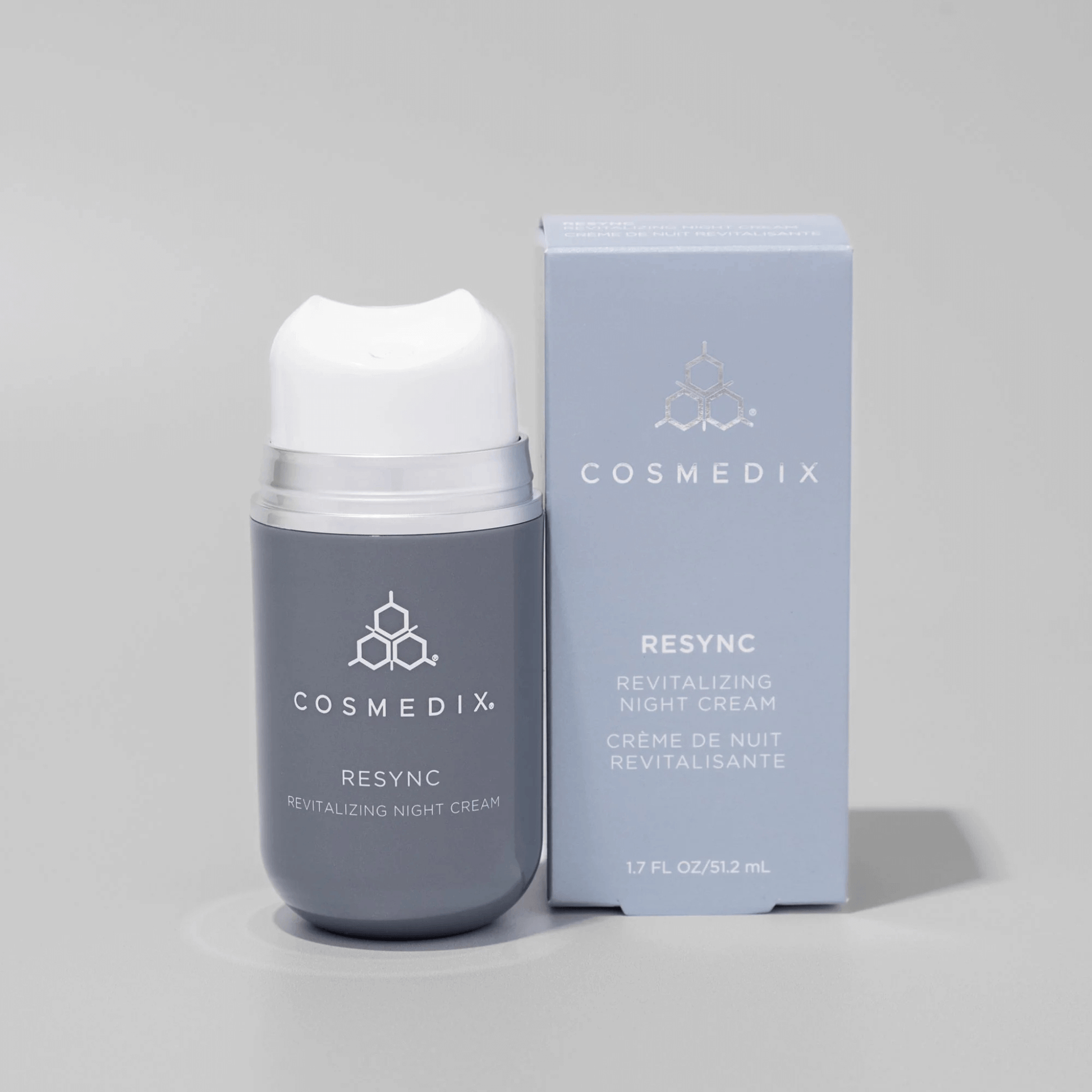 Cosmedix Resync Revitalizing Night Cream with packaging on a grey background