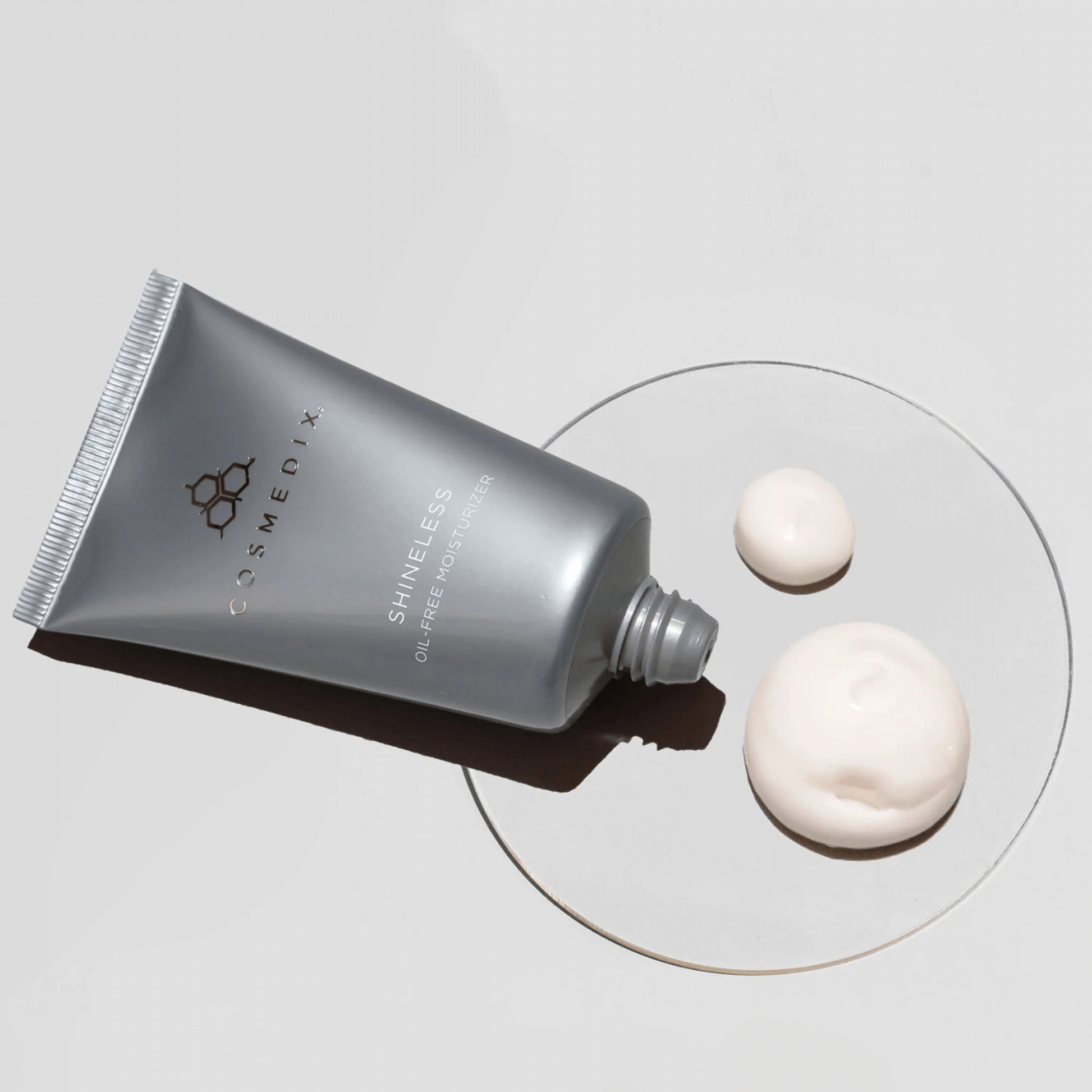Cosmedix Shineless skincare product with two samples on a grey background