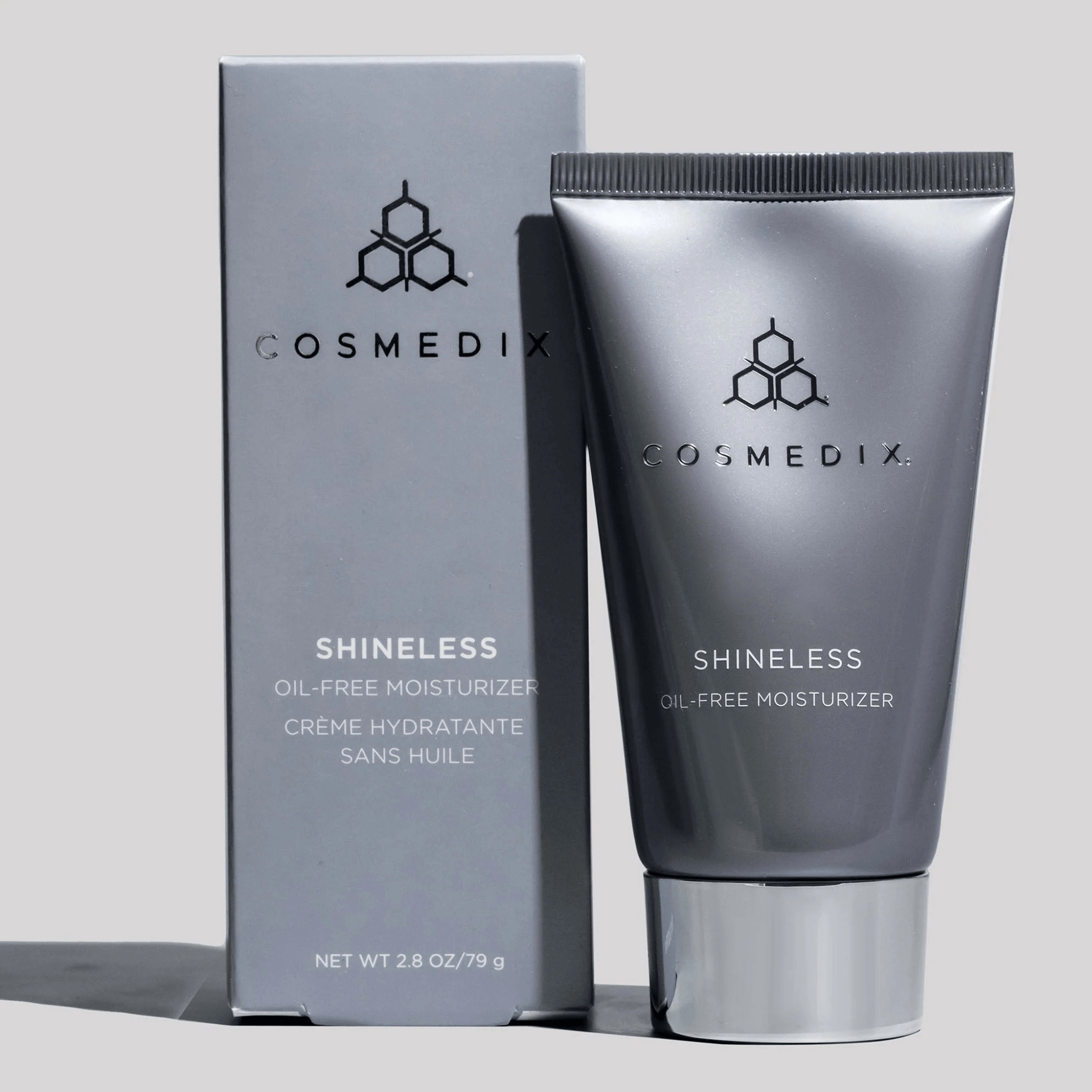 Cosmedix Shineless oil-free moisturiser tube and packaging on a light grey background