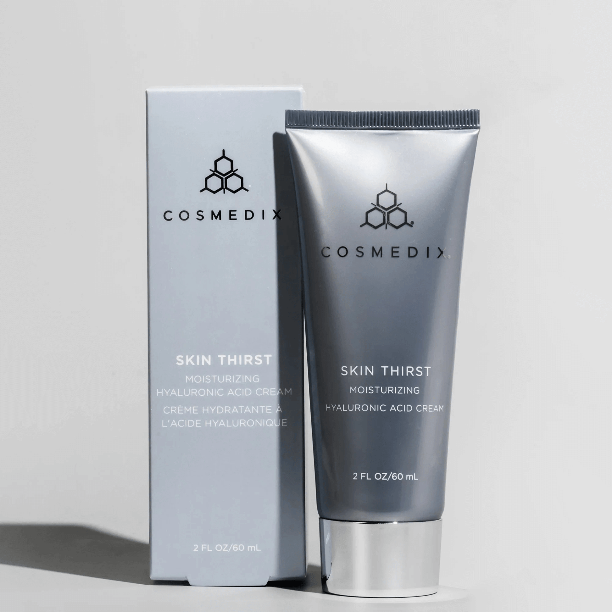 Cosmedix Skin Thirst moisturizing cream tube and packaging on a light grey background