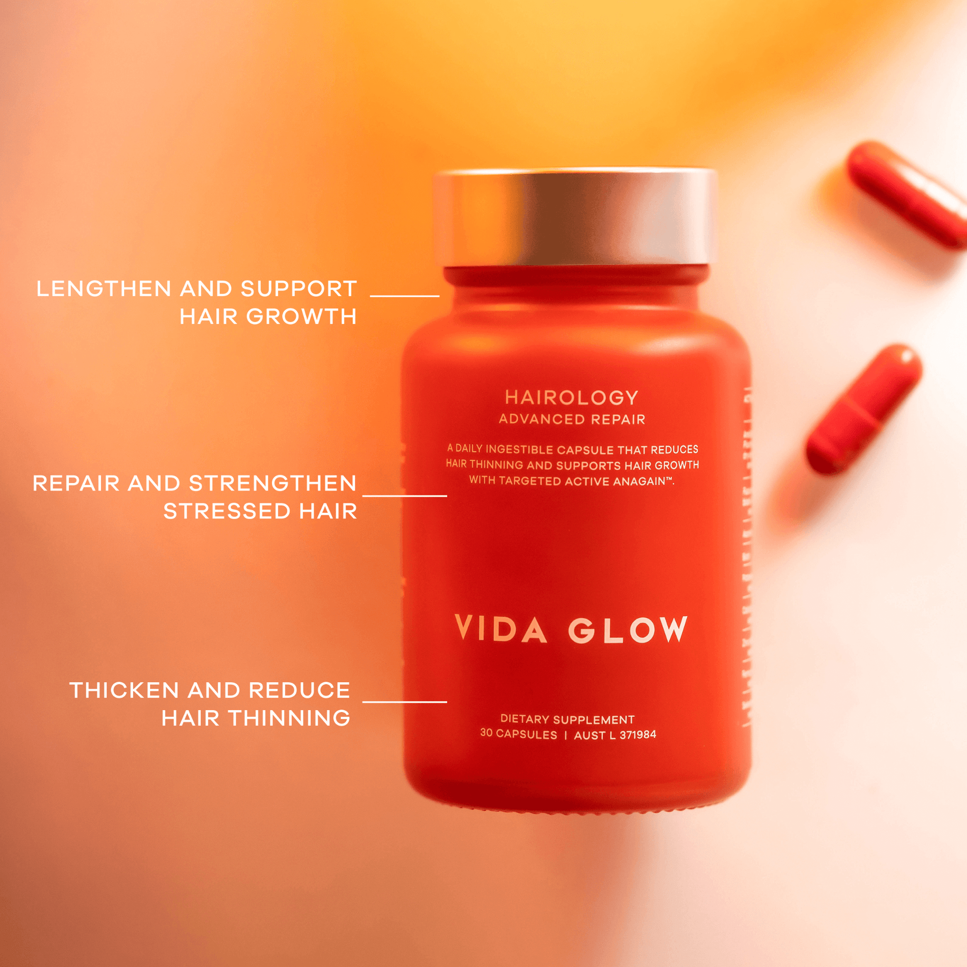 Vida Glow Hairology hair supplement bottle with text highlighting benefits on an orange background