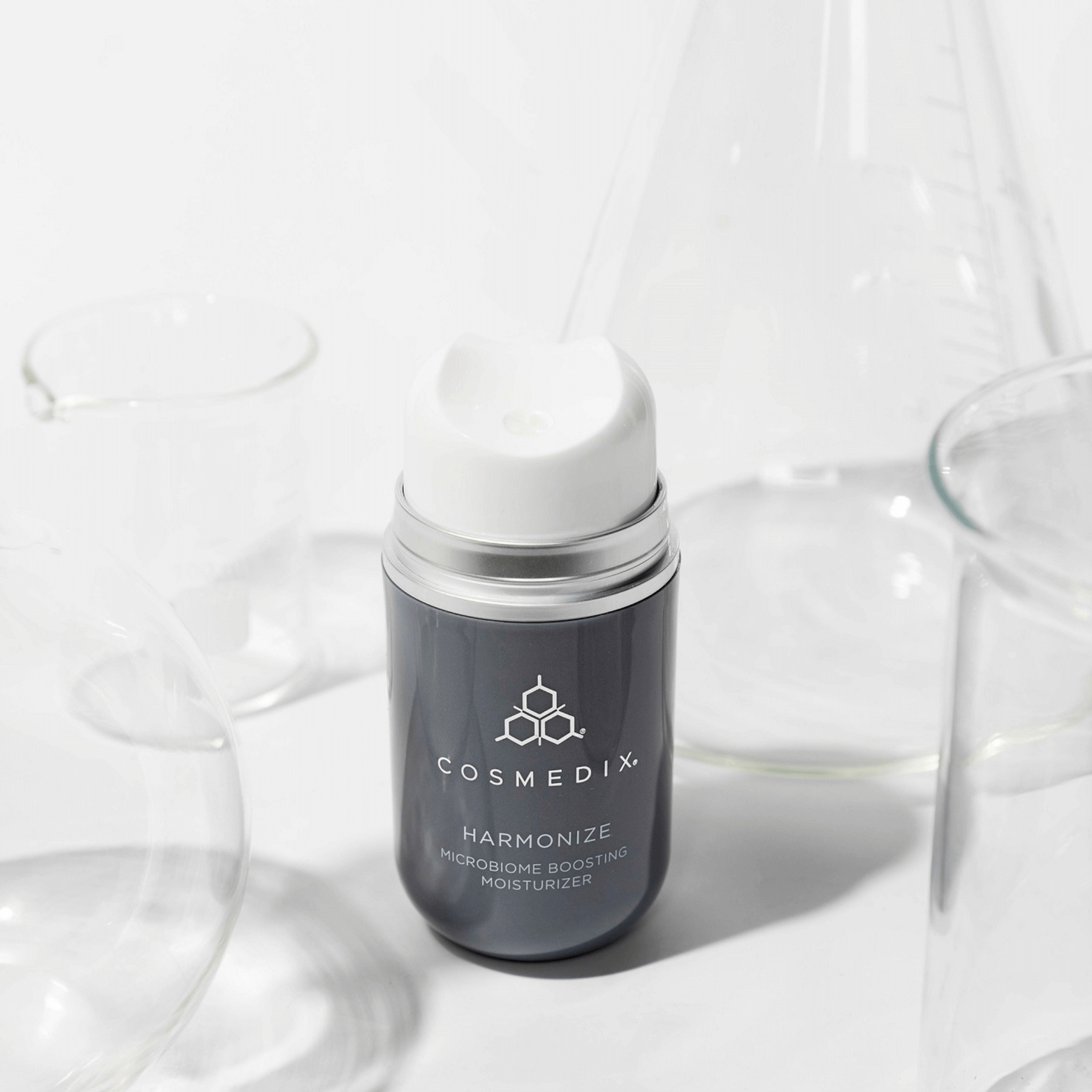 Cosmedix Harmonize moisturizer bottle on a white background