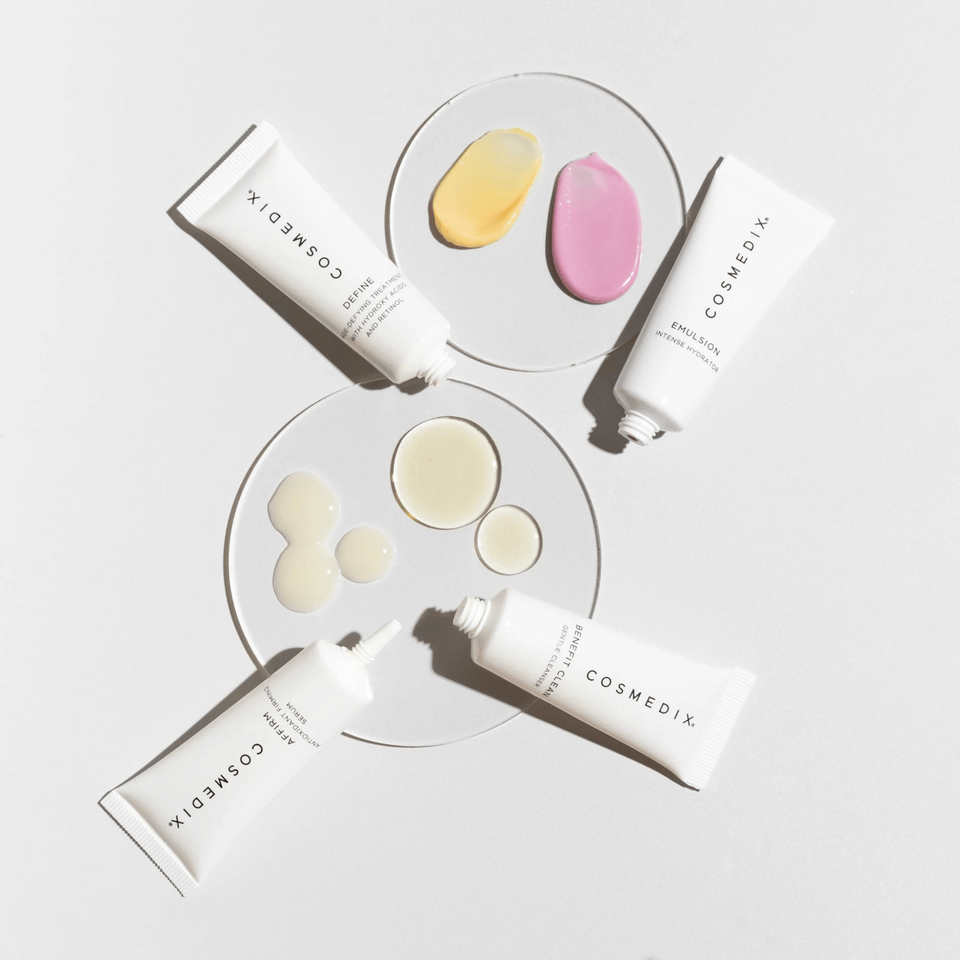Cosmedix skincare products with sample applications on a white background