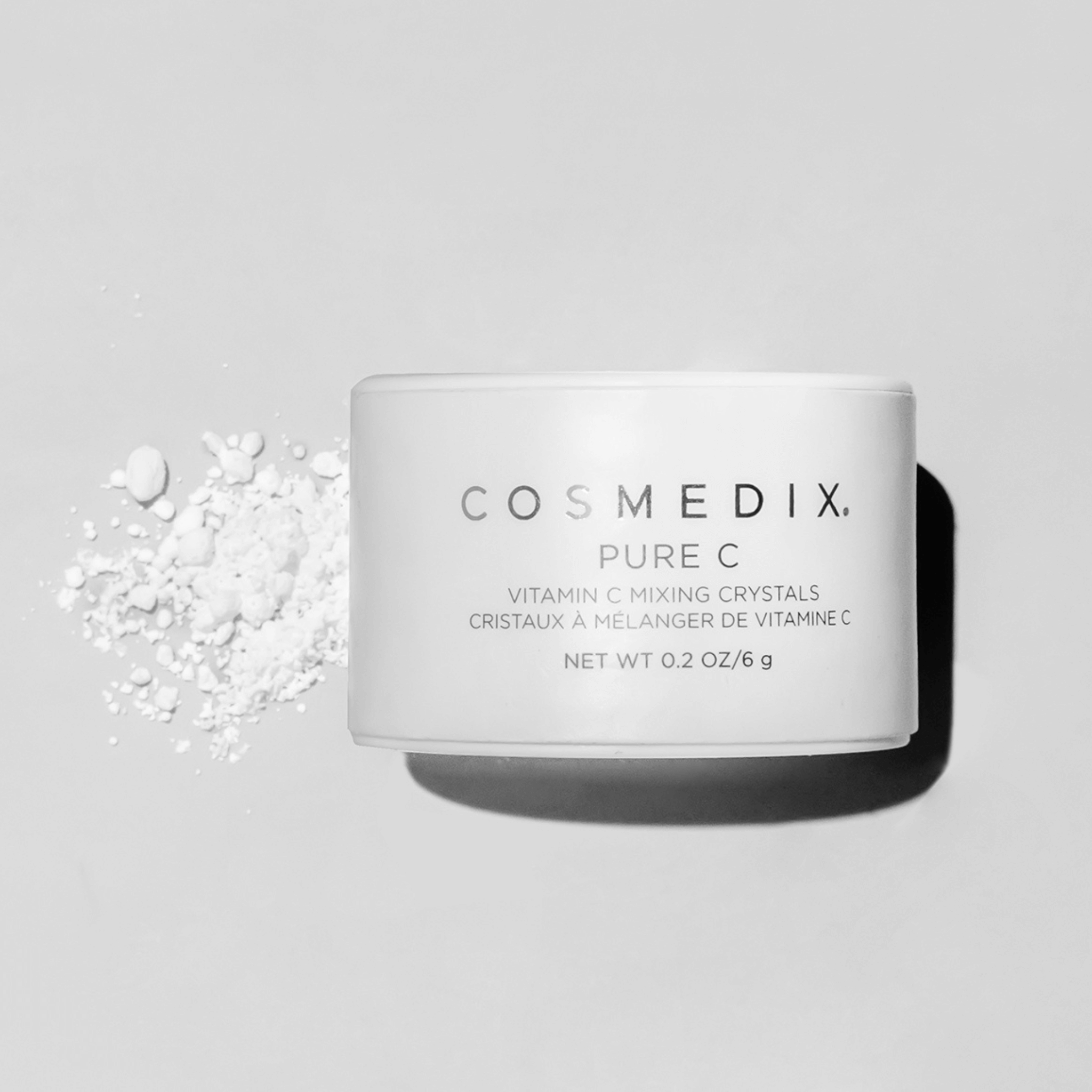 Cosmedix Pure C vitamin C mixing crystals container on a light grey background